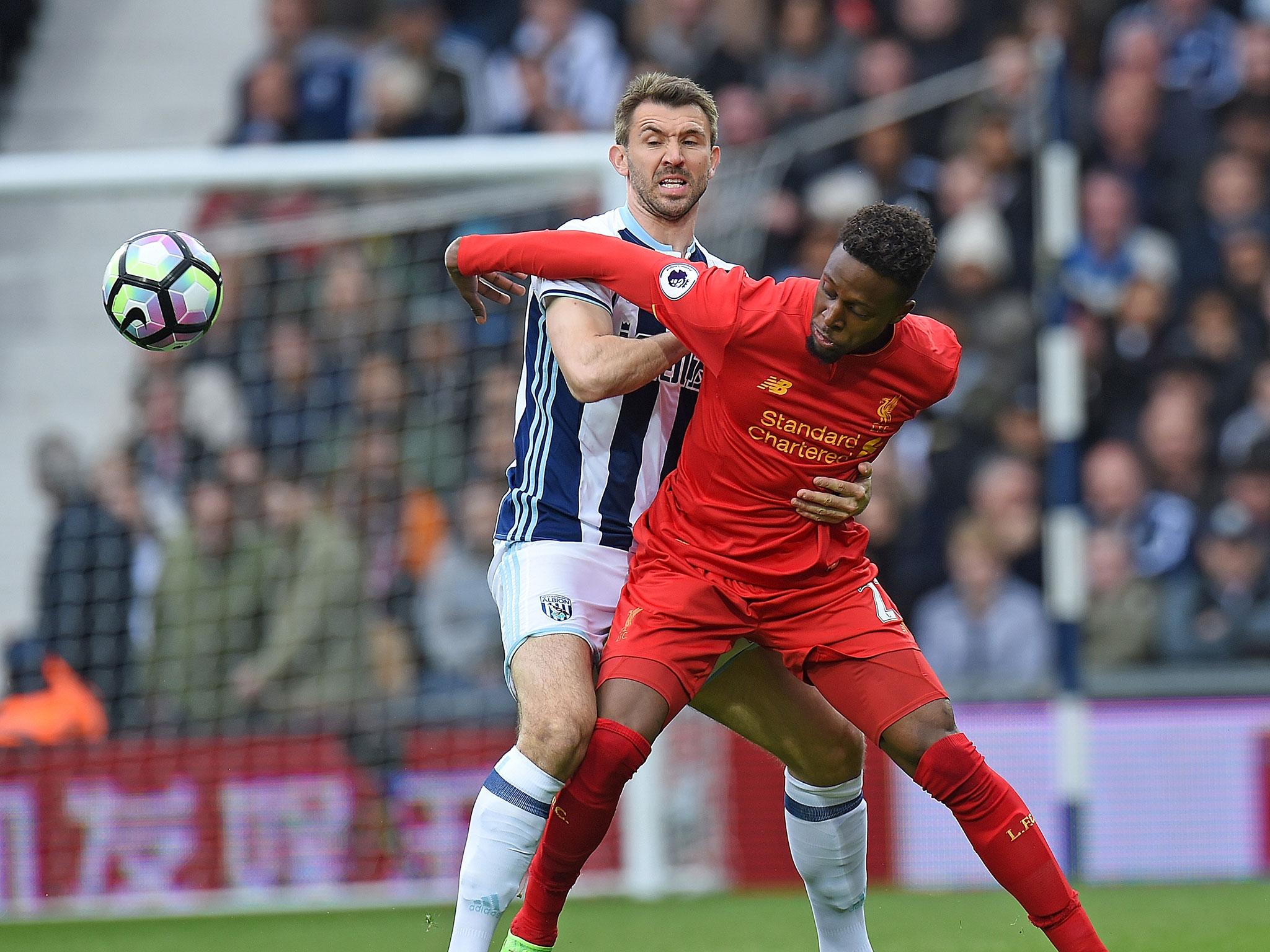 Held his shape well alongside Evans but struggled at times to keep Firmino under wraps.