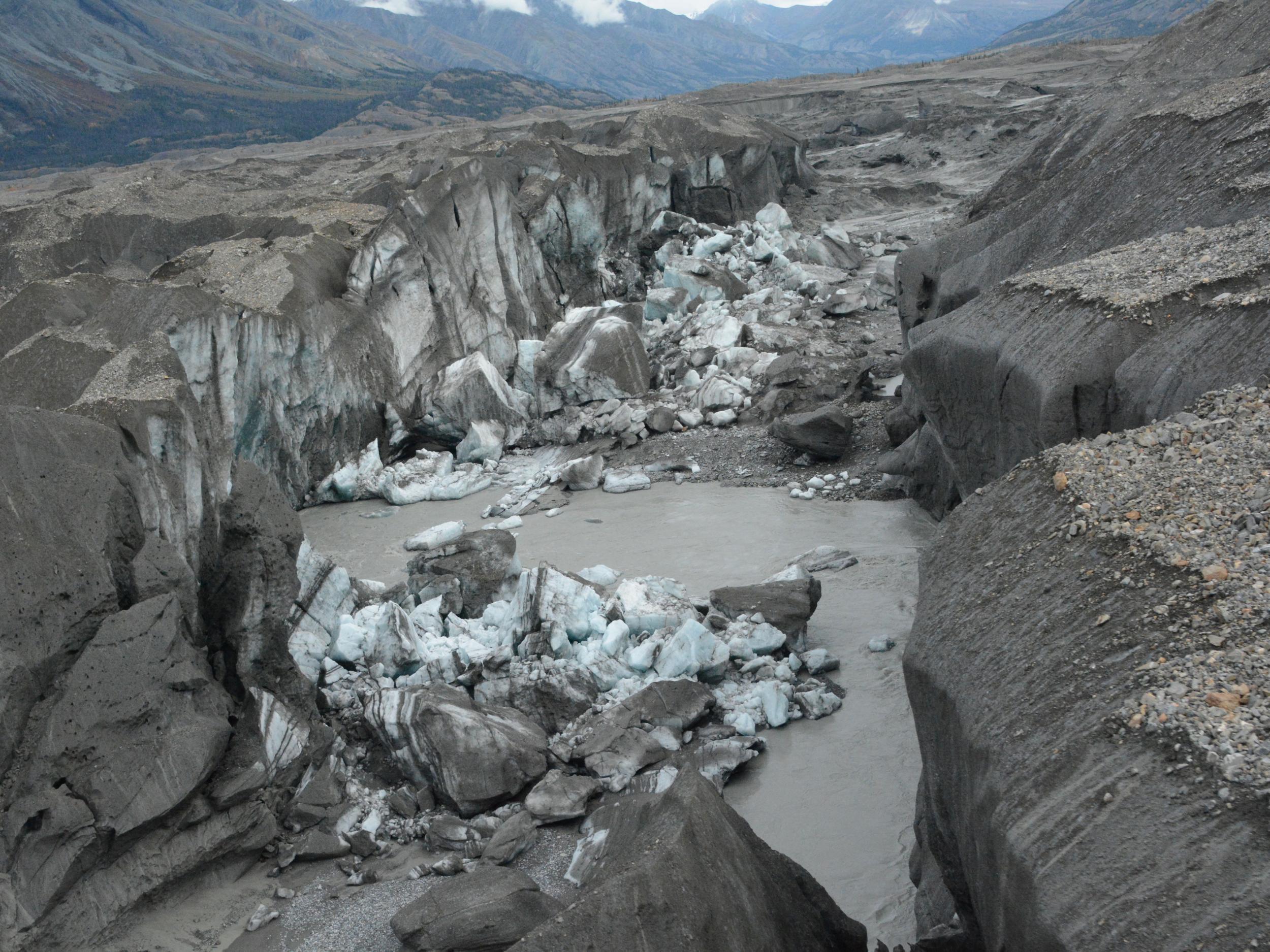 A close-up view of the ice-walled canyon at the end of the Kaskawulsh glacier. This canyon now carries almost all meltwater from the toe of the glacier down the Kaskawulsh Valley, rather than into the Slims River