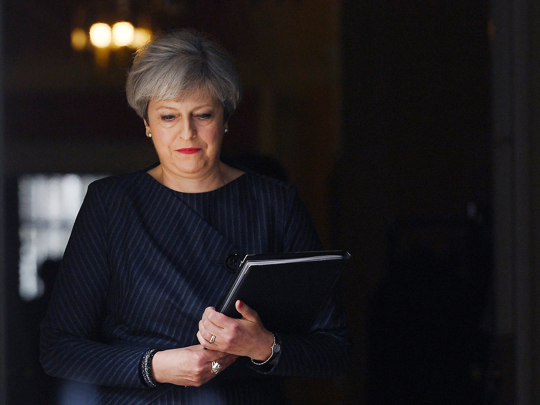 Theresa May exits 10 Downing Street on 18 April 2017 to announce a snap election