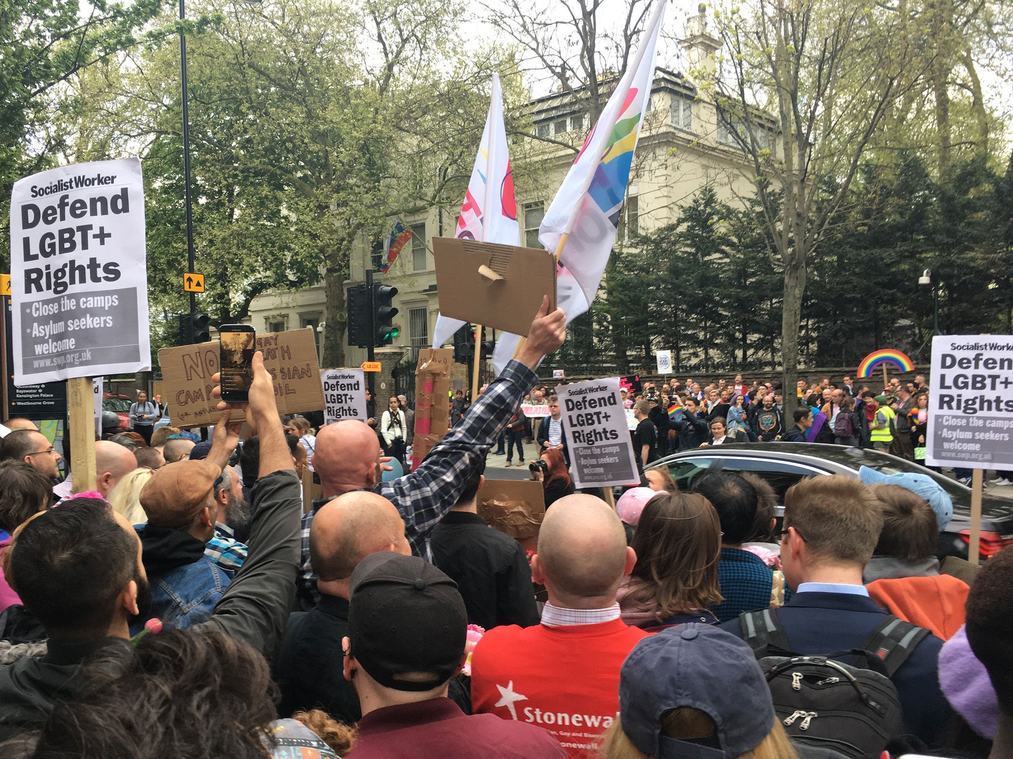 People hold a protest outside Russian Embassy in London, following reports of the torture and murder of gay men in Chechnya on 12 April