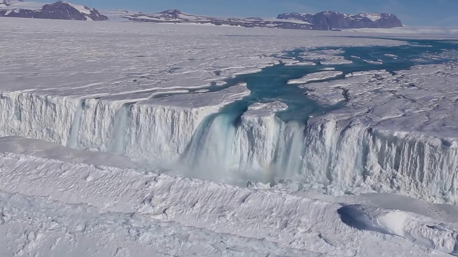 A 120m-wide waterfall drains from the Nansen Ice Shelf into the ocean