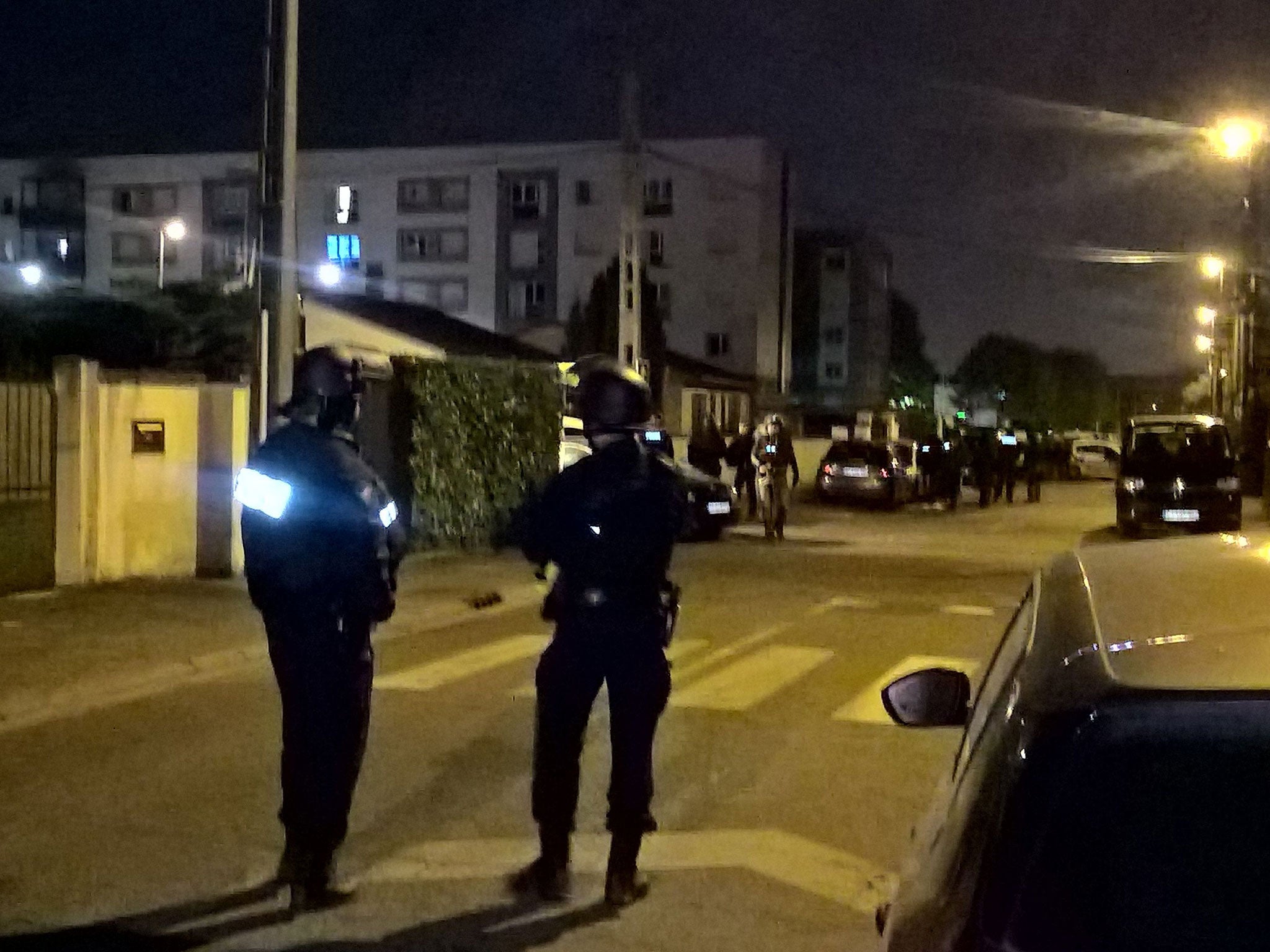 Police officers search the house of a suspect after a gunman opened fire on police in the Champs Elysees, in Chelles on 20 April