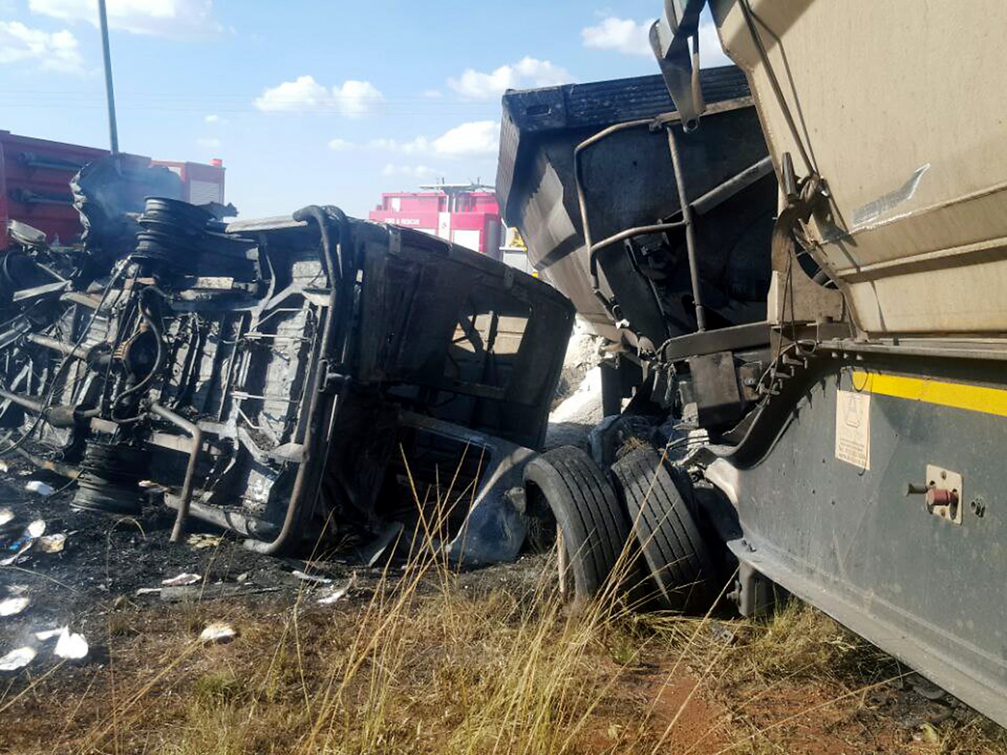 A truck crashed into the bus carrying school children home. After the impact the bus burst into flames