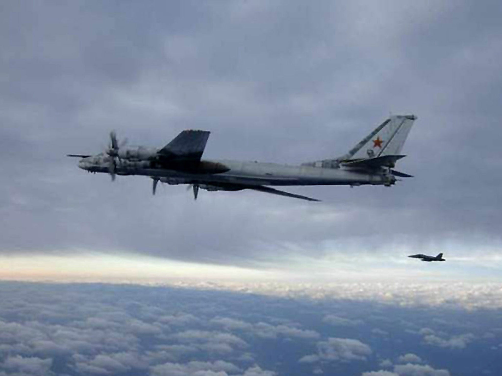 An F/A-18 Hornet escorts a Russian Tu-95 Bear bomber aircraft in February 2008 south of Japan