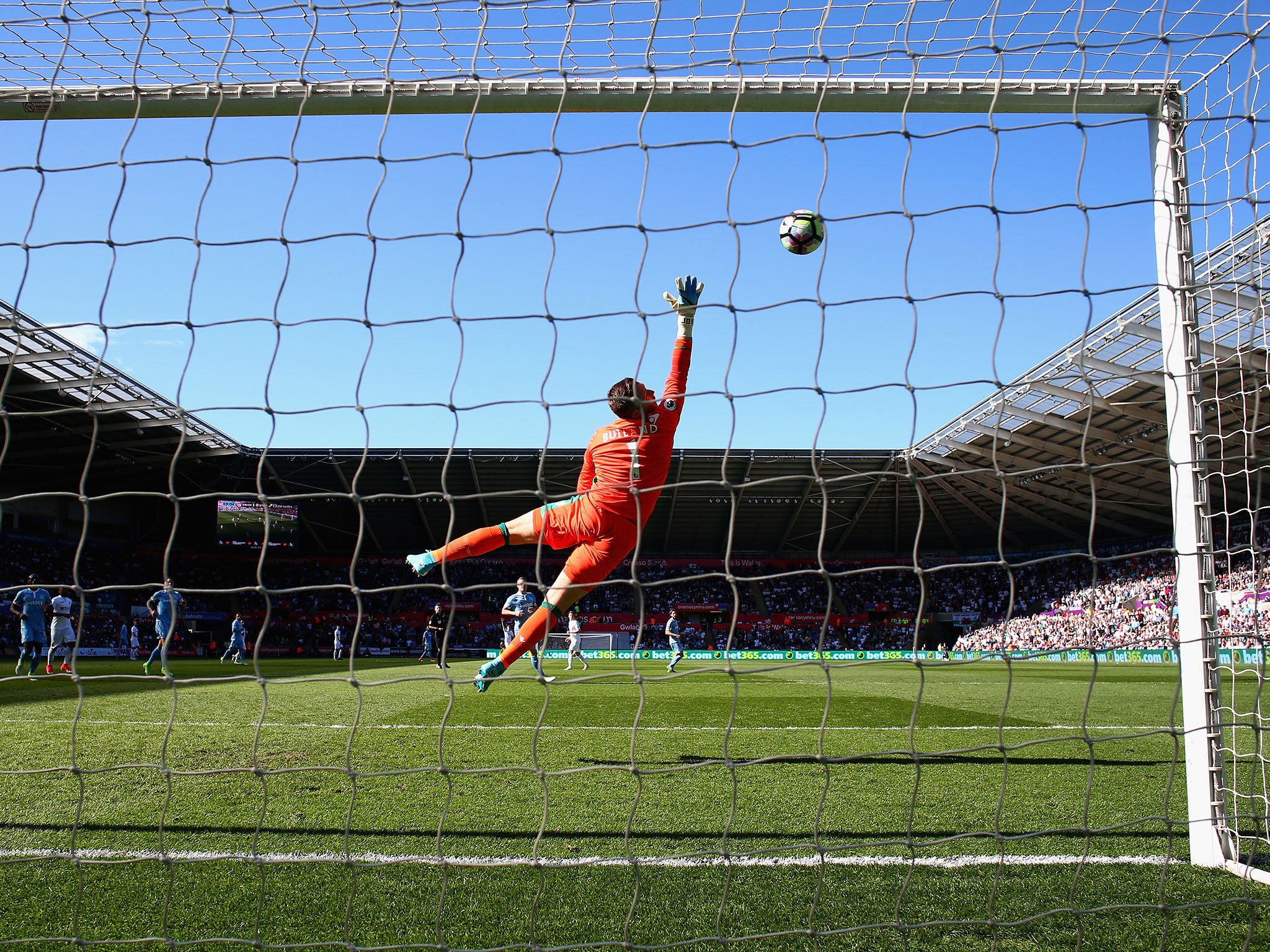 Jack Butland reaches in vain to stop Carroll's strike