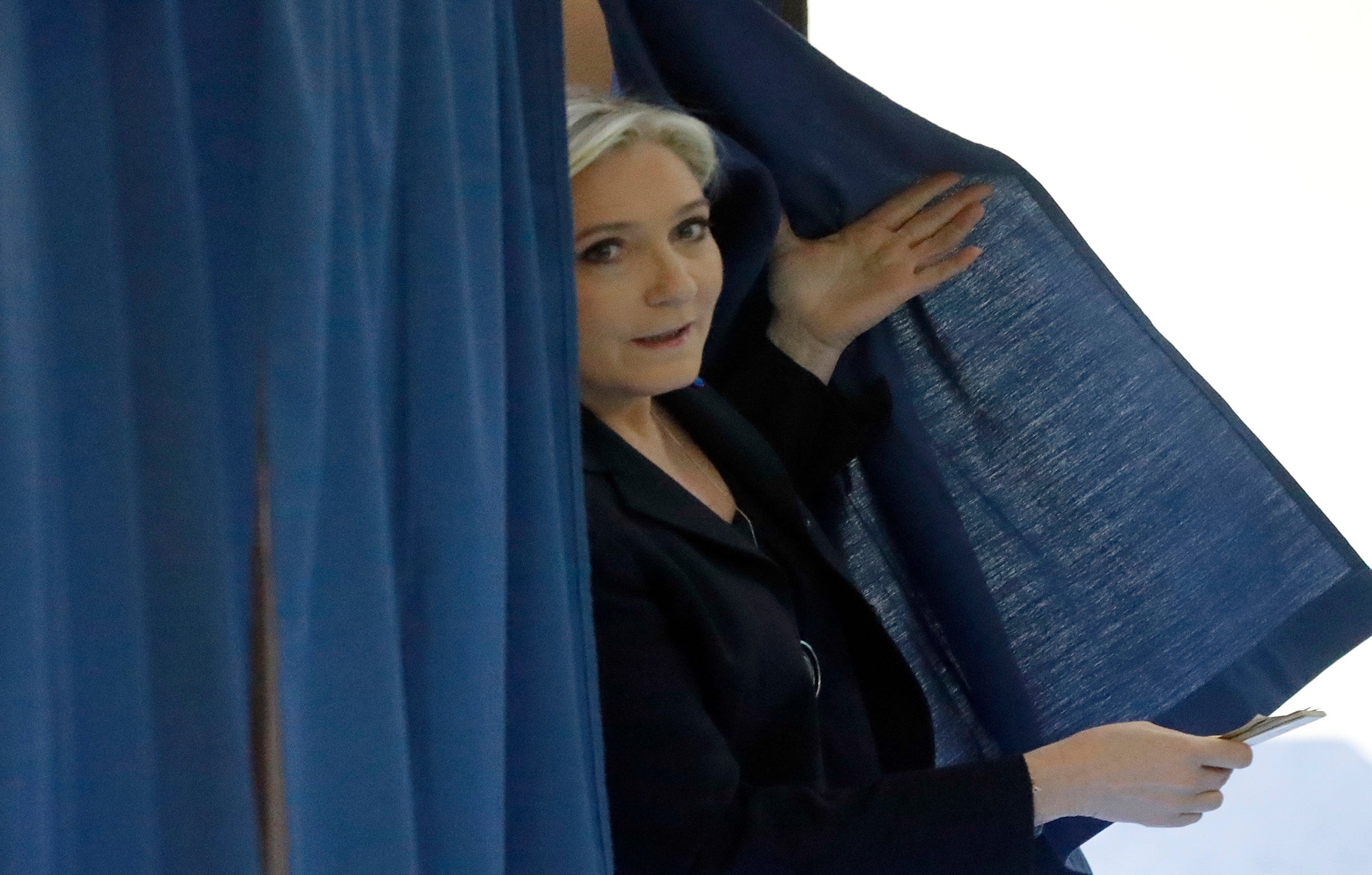 Far-right French presidential candidate Marine Le Pen exits a polling booth