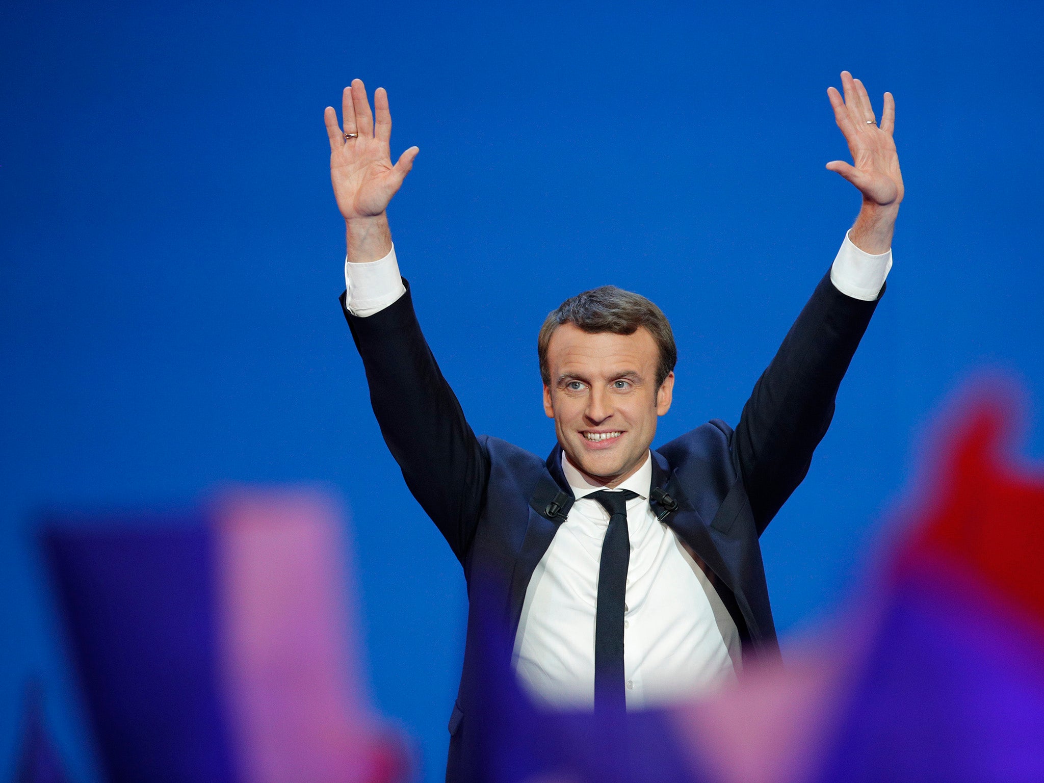 Emmanuel Macron takes to the stage after the first results of the election were announced