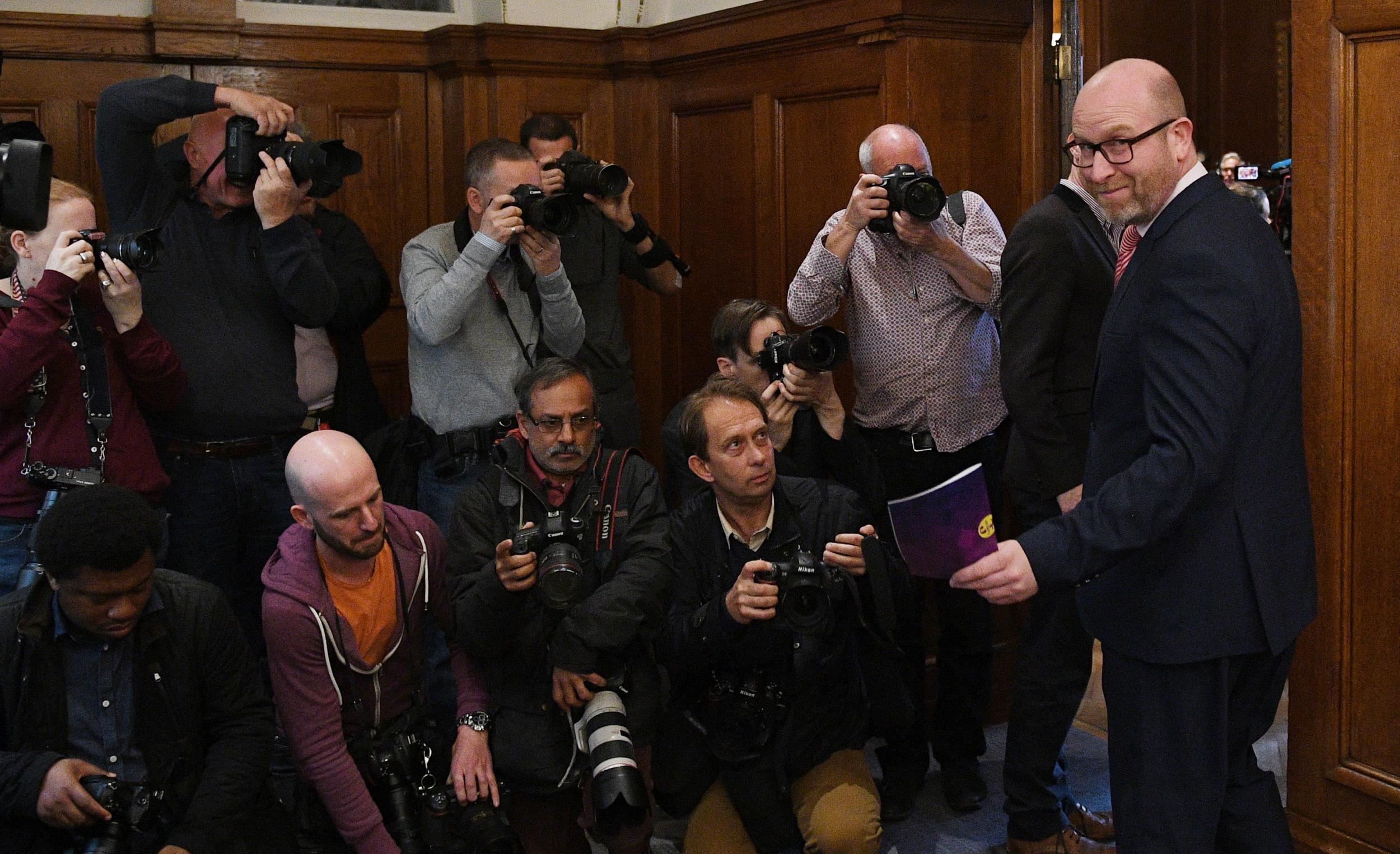 Paul Nuttall (R) arrives to deliver a party's policy announcement at Marriott County Hall London