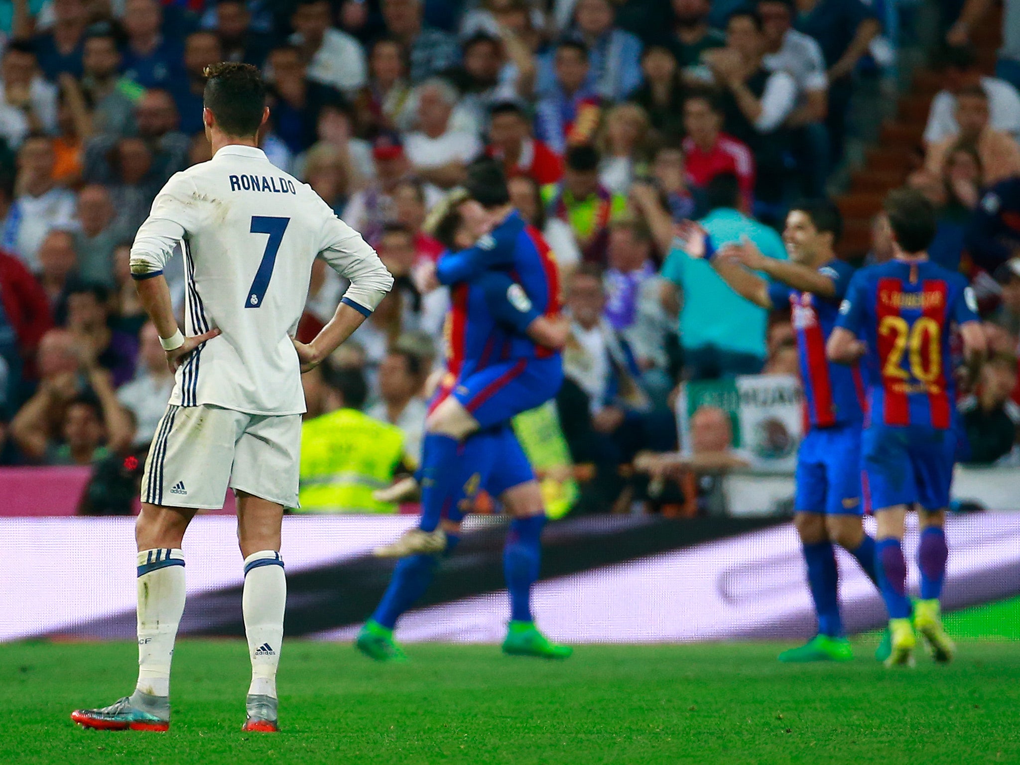 Cristiano Ronaldo looks on after Lionel Messi's late winner at the Bernabeu