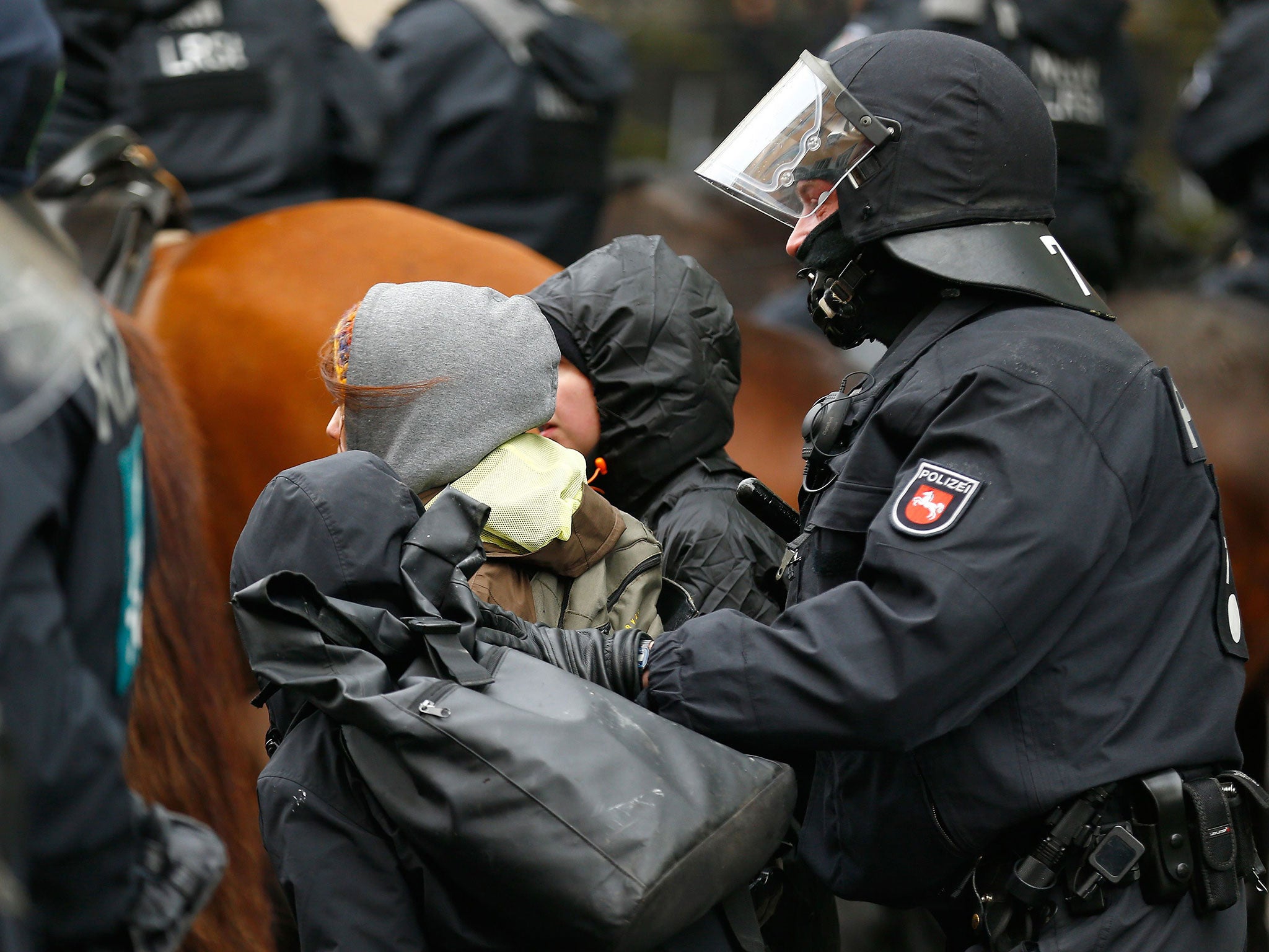 &#13;
Police arrest activists during a demonstration against anti-immigration party the Alternative for Germany (AfD) before its convention in Cologne on 22 April &#13;