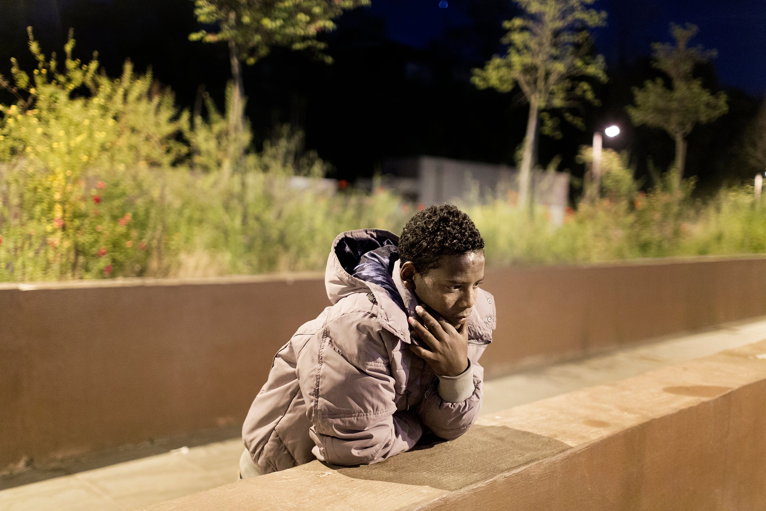 Hishay Liul, 17, from Eritrea, stands outside the Tiburtina train station in Rome