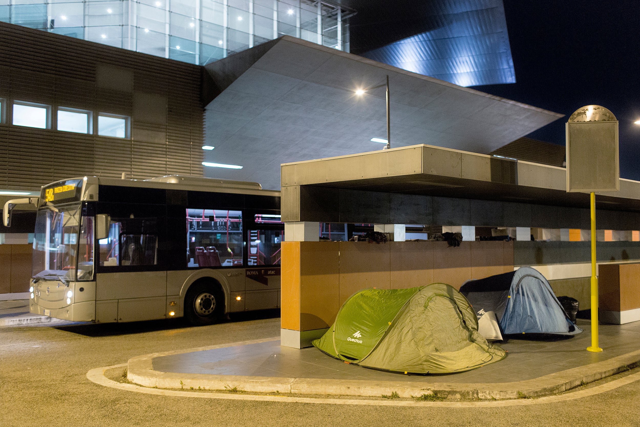 Tents set up for the night by migrants and refugees outside Tiburtina train station in Rome on 11 April