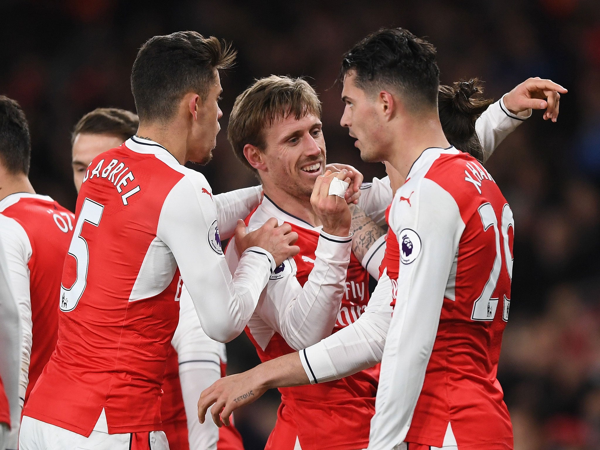 Arsenal's players congratulated Monreal on his deflected strike