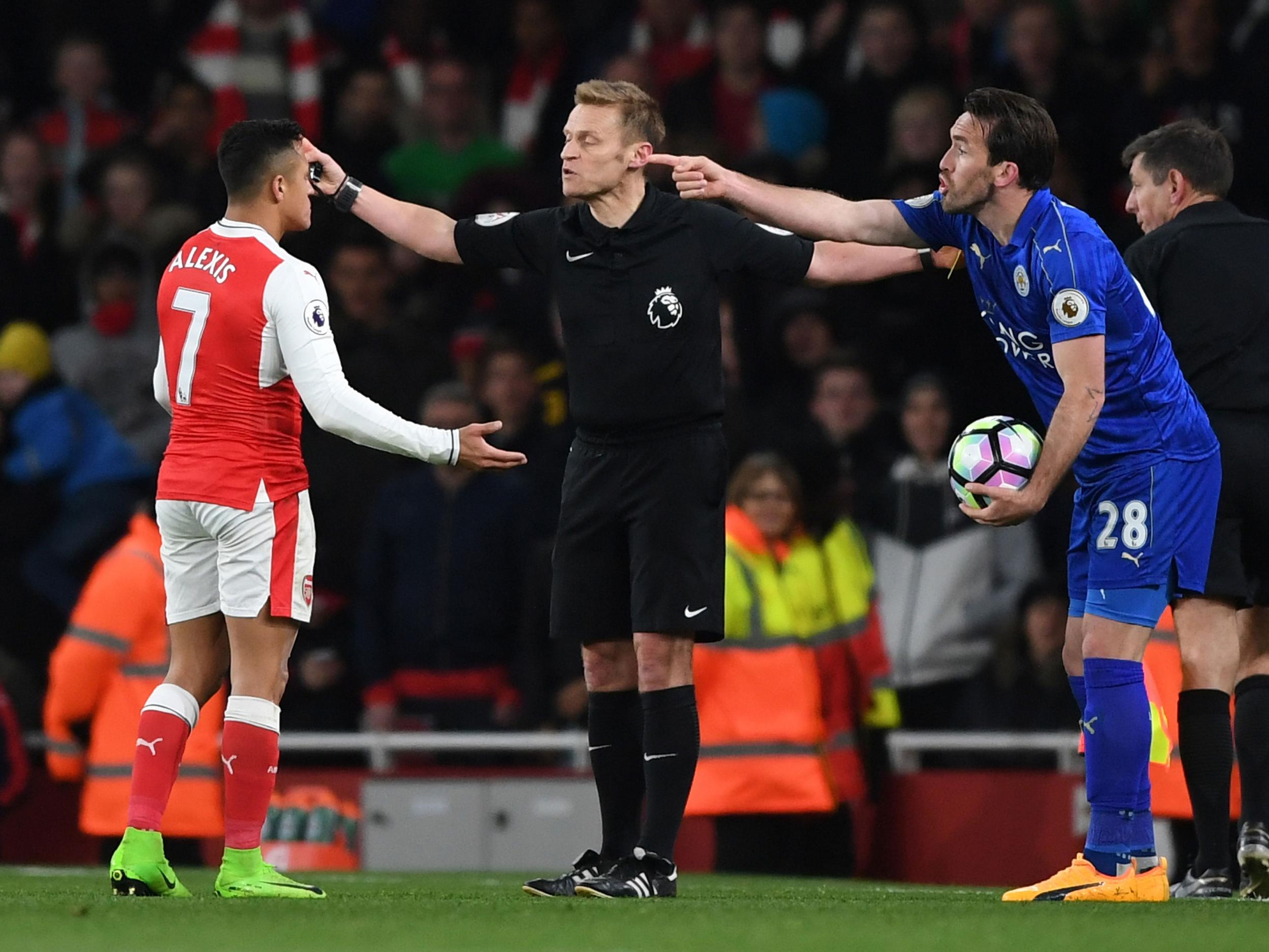 Alexis Sanchez was yellow-carded for his part in the spat with Christian Fuchs