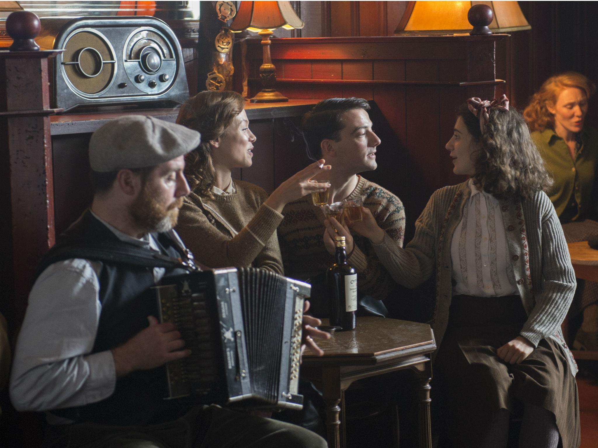 Kendrick (right) as Catriona Macroon with Kevin Guthrie (centre) as George and Naomi Battrick (left) as Peggy Macroon in 'Whisky Galore!'