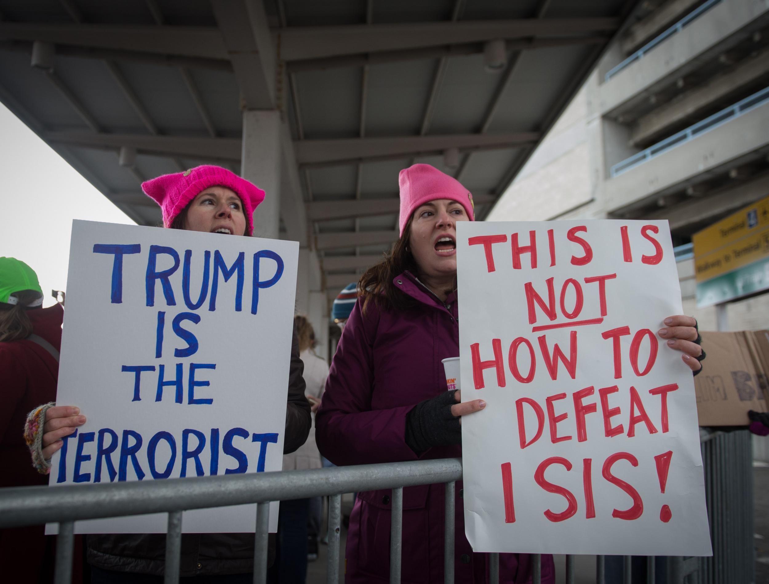 Protesters gather at JFK International Airport to demonstrate against US President Donald Trump's executive order