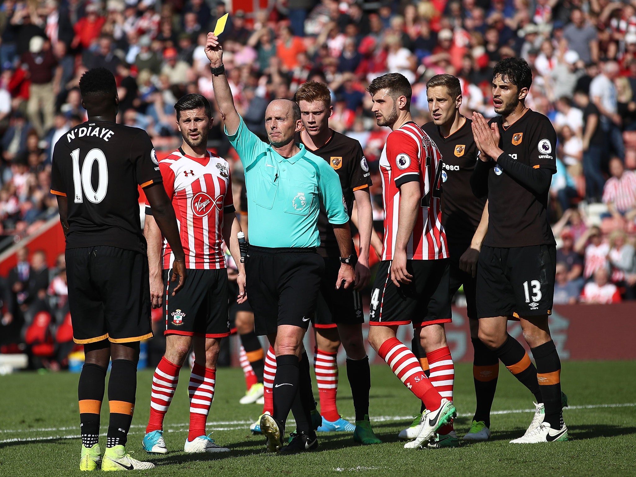 Alfred N'Diaye is booked for conceding the penalty