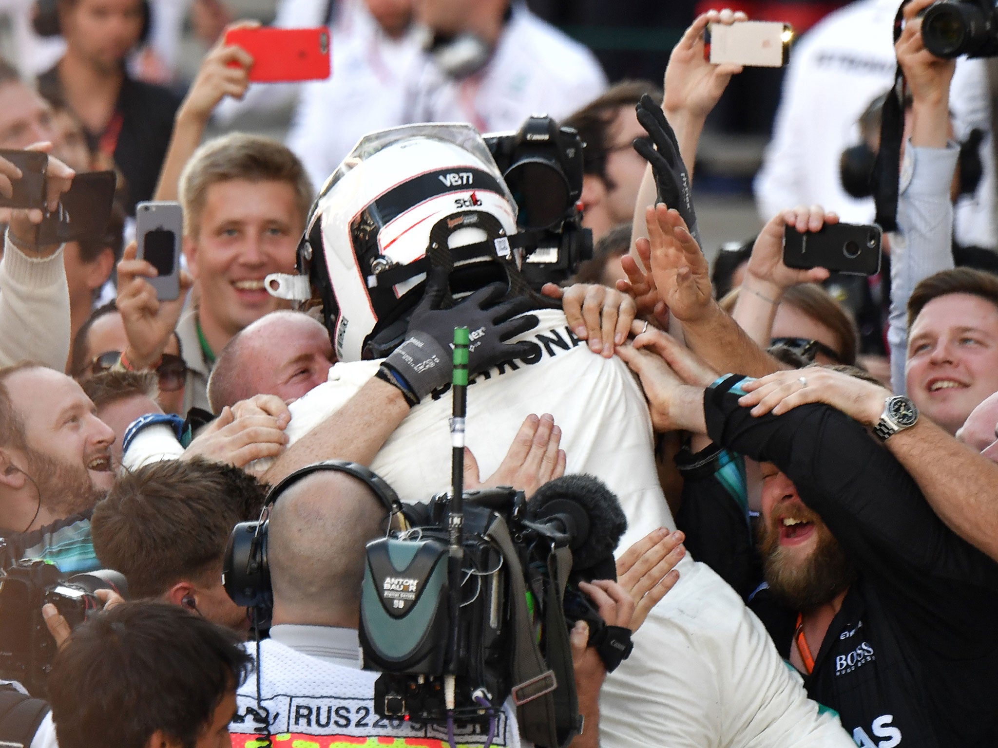 Bottas celebrates with the crowd after securing victory