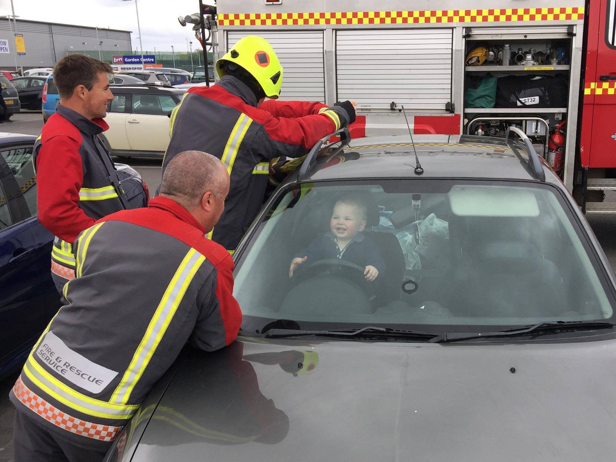 Firefighters rescuing 14-month-old Brandon from his mother's car in Bude, Cornwall