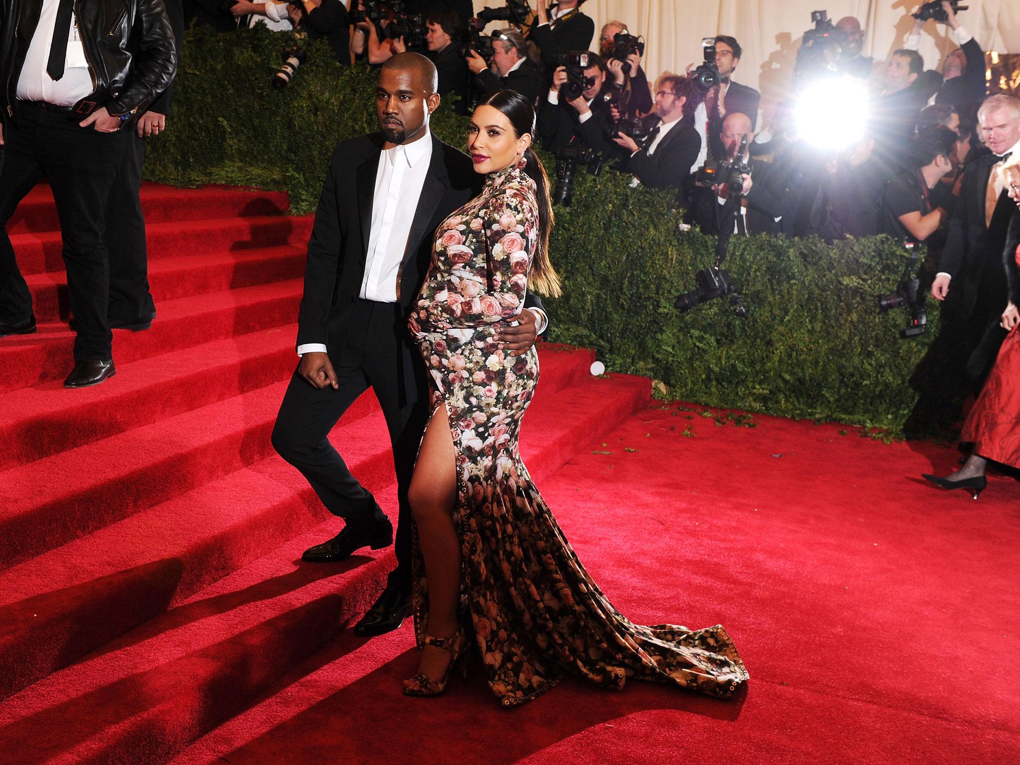 Kim Kardashian West wearing a Riccardo Tisci dress and Kanye West at their first Met Gala in 2013 (Getty Images )