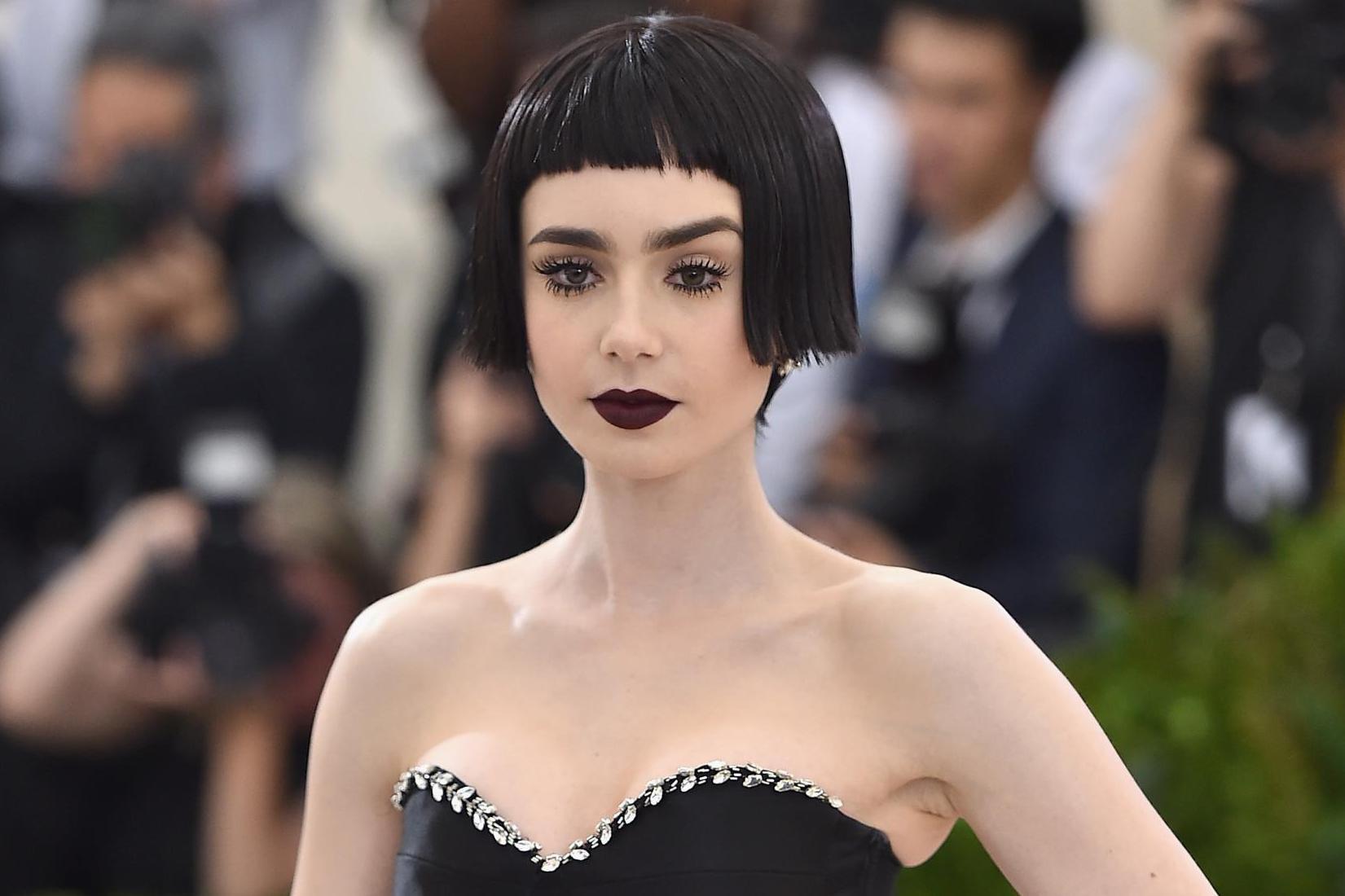 Actress Lily Collins paid tribute to Kawakubo with a short, black wig