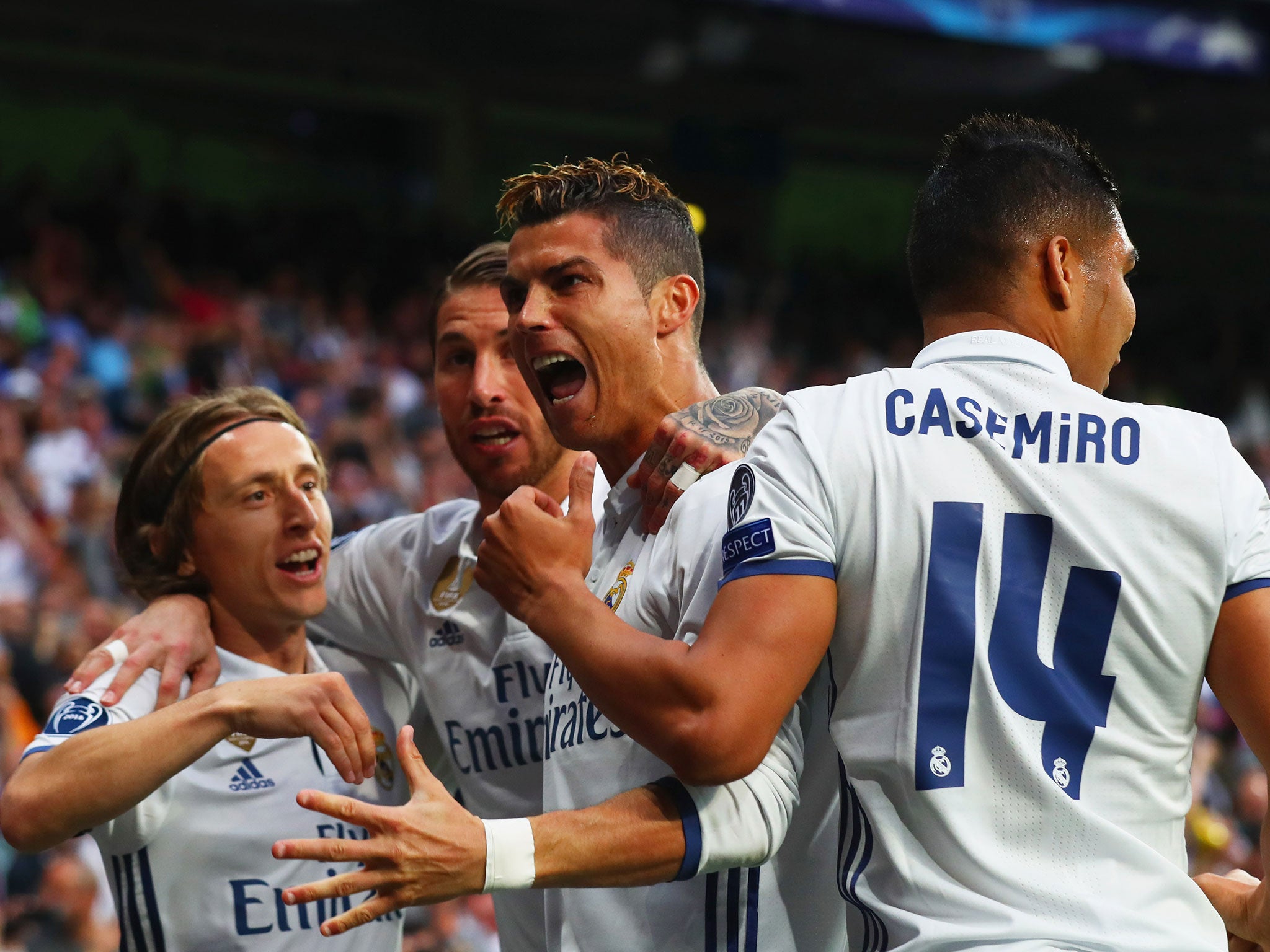 Ronaldo celebrates with team-mates after scoring his third