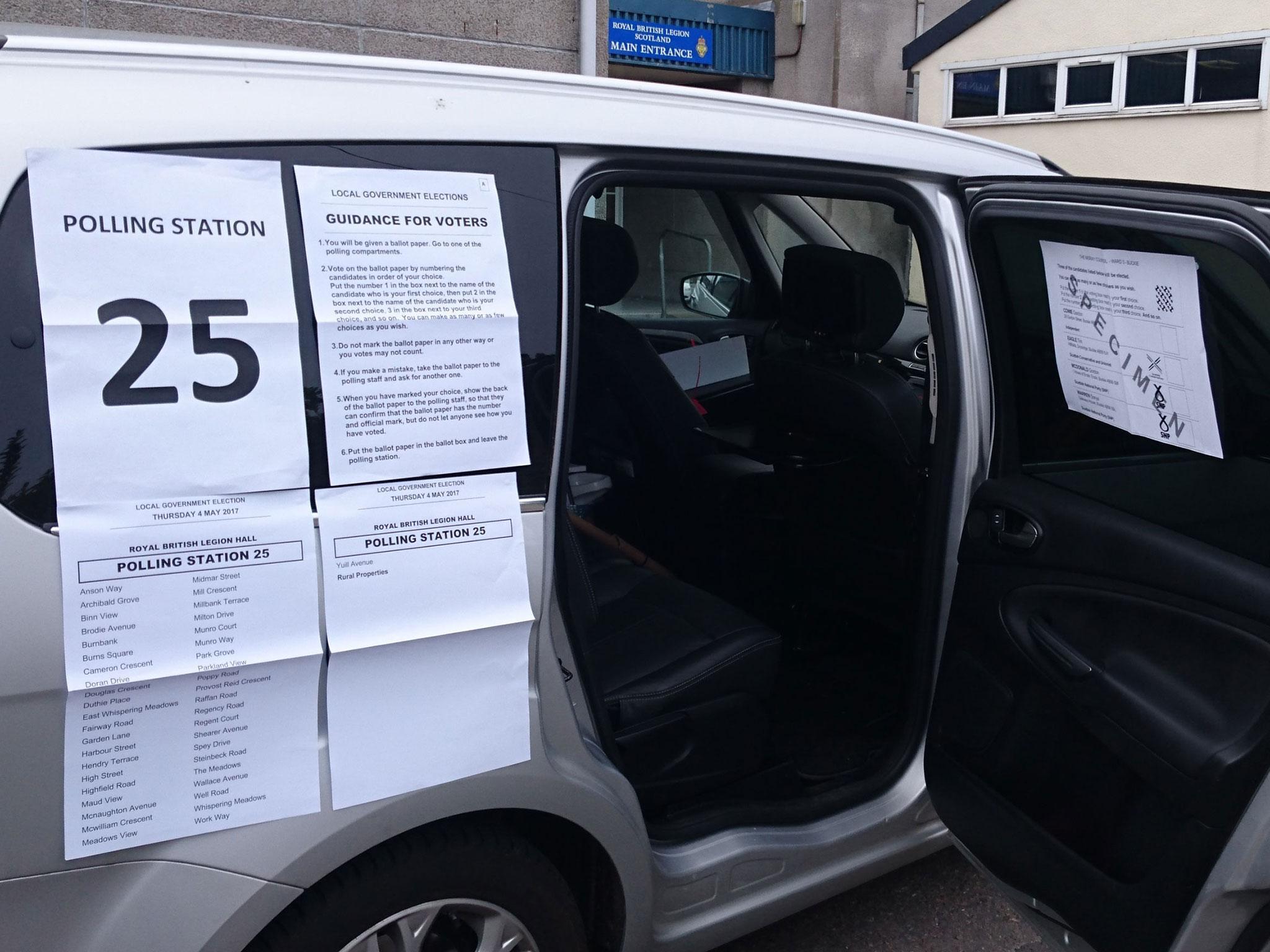 Two early voters turned out to exercise their democratic right in the back of the car