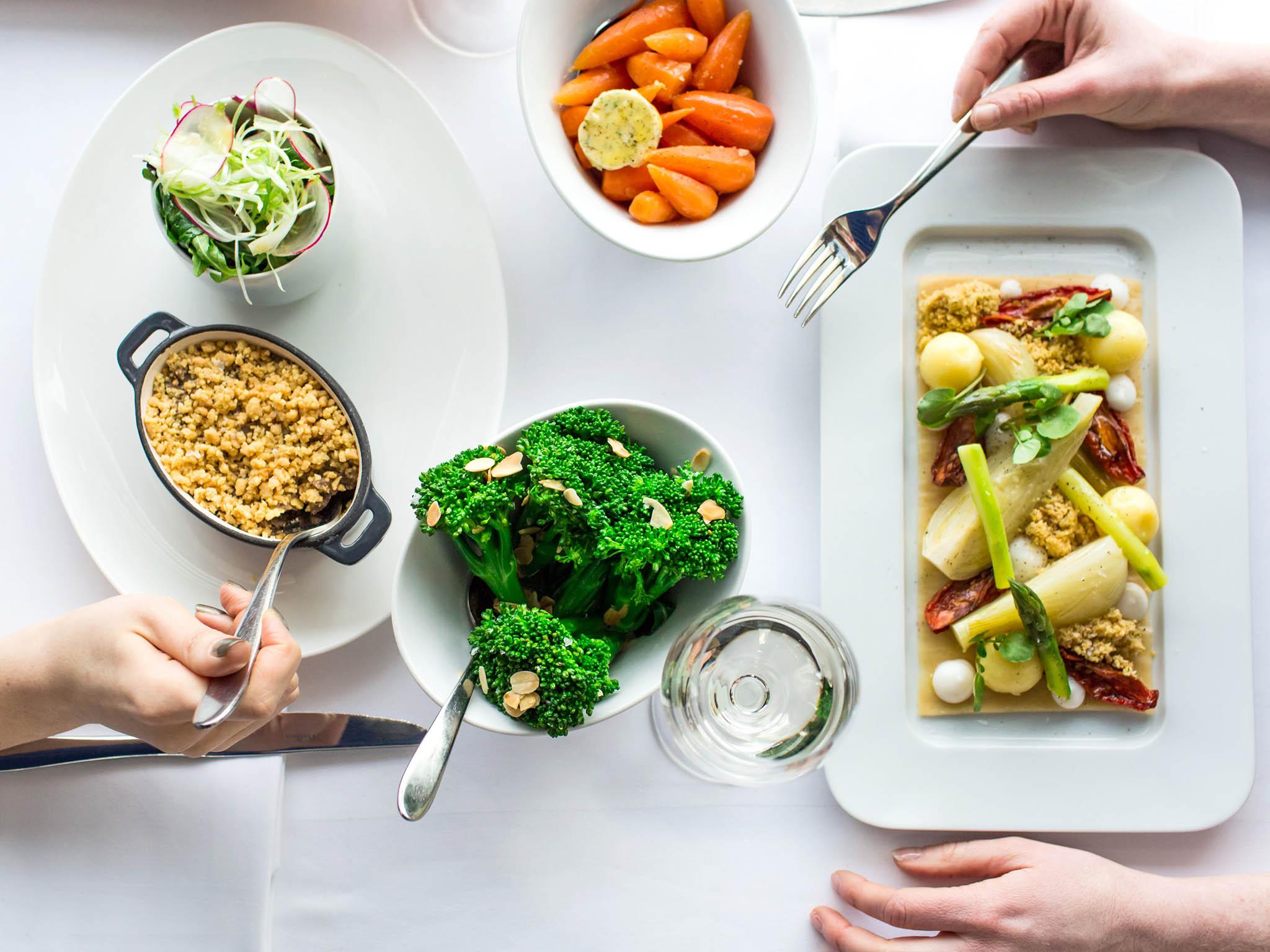 Walnut, tofu and cheese crumble and potato pave with broccoli and carrot side dishes