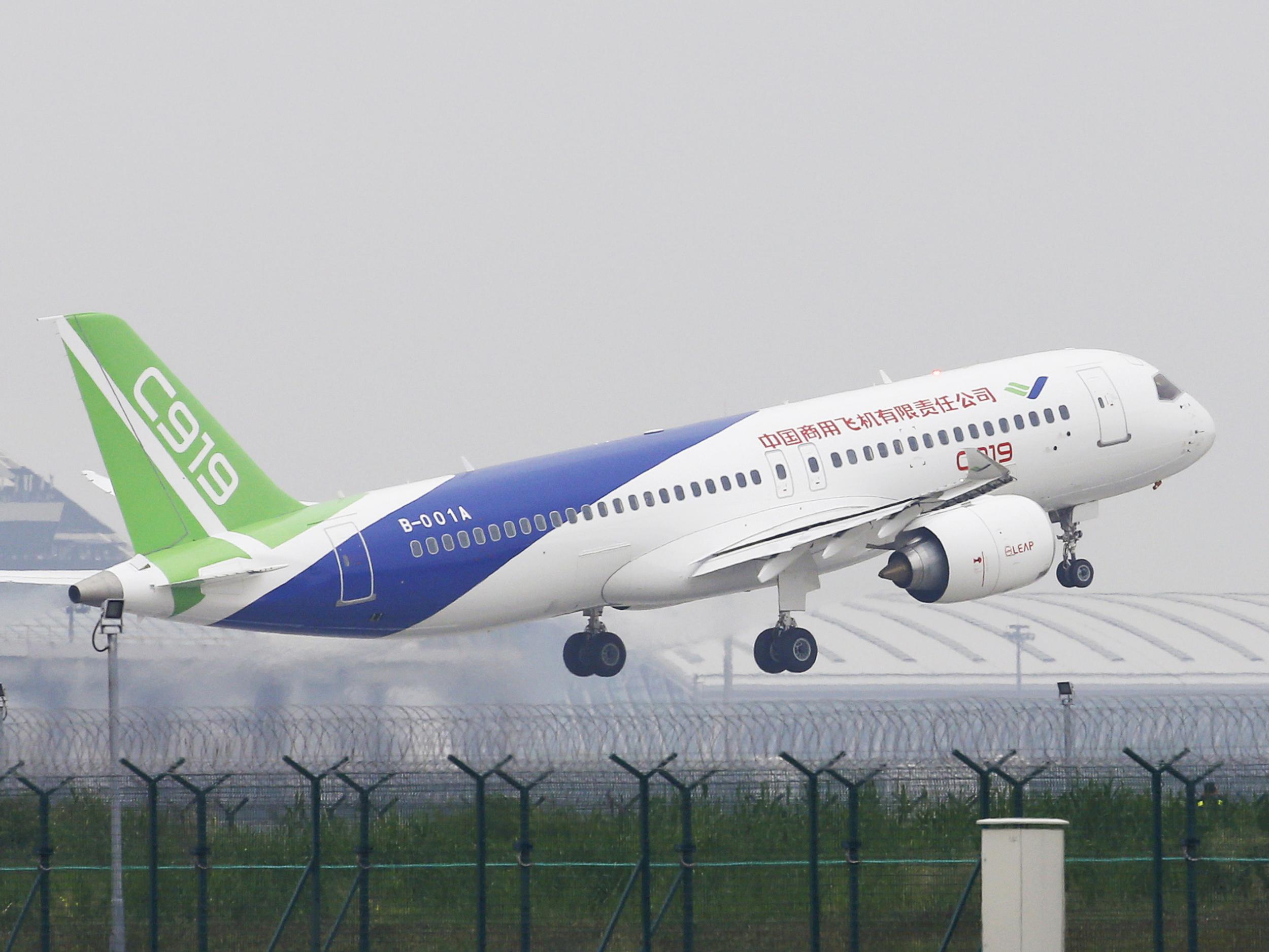 The Chinese-made C919 passenger jet takes off on its first flight at Pudong International Airport in Shanghai