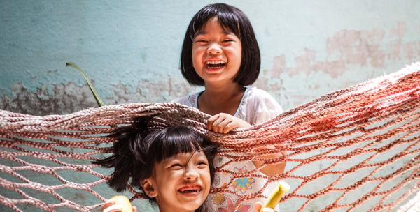 Children playing in Vietnam. When it floods, transport to and from school is a major challenge