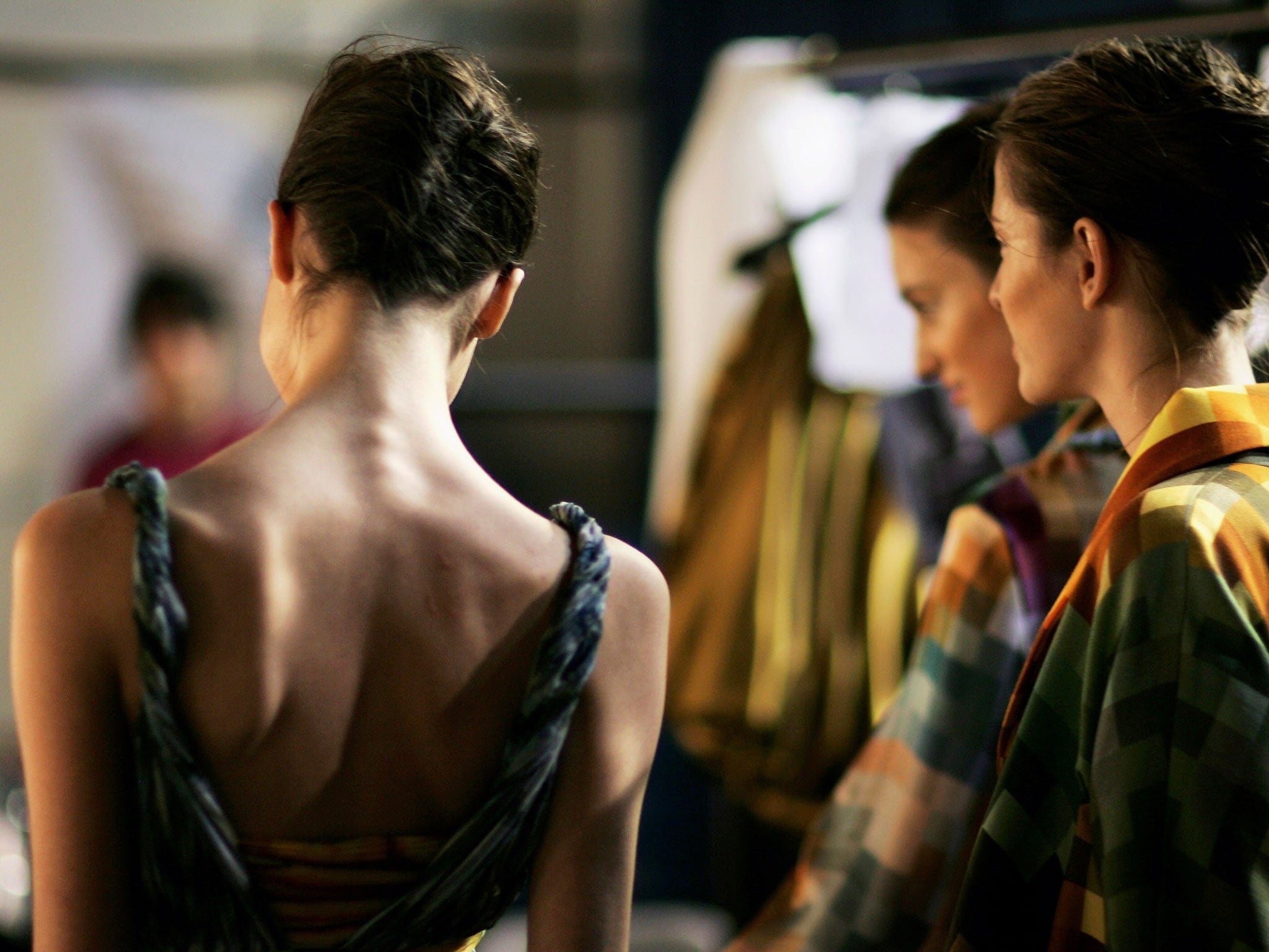 Models pose for a photographer backstage before Basso & Brooke's Autumn/Winter show at London Fashion Week on February 14, 2007 in London.