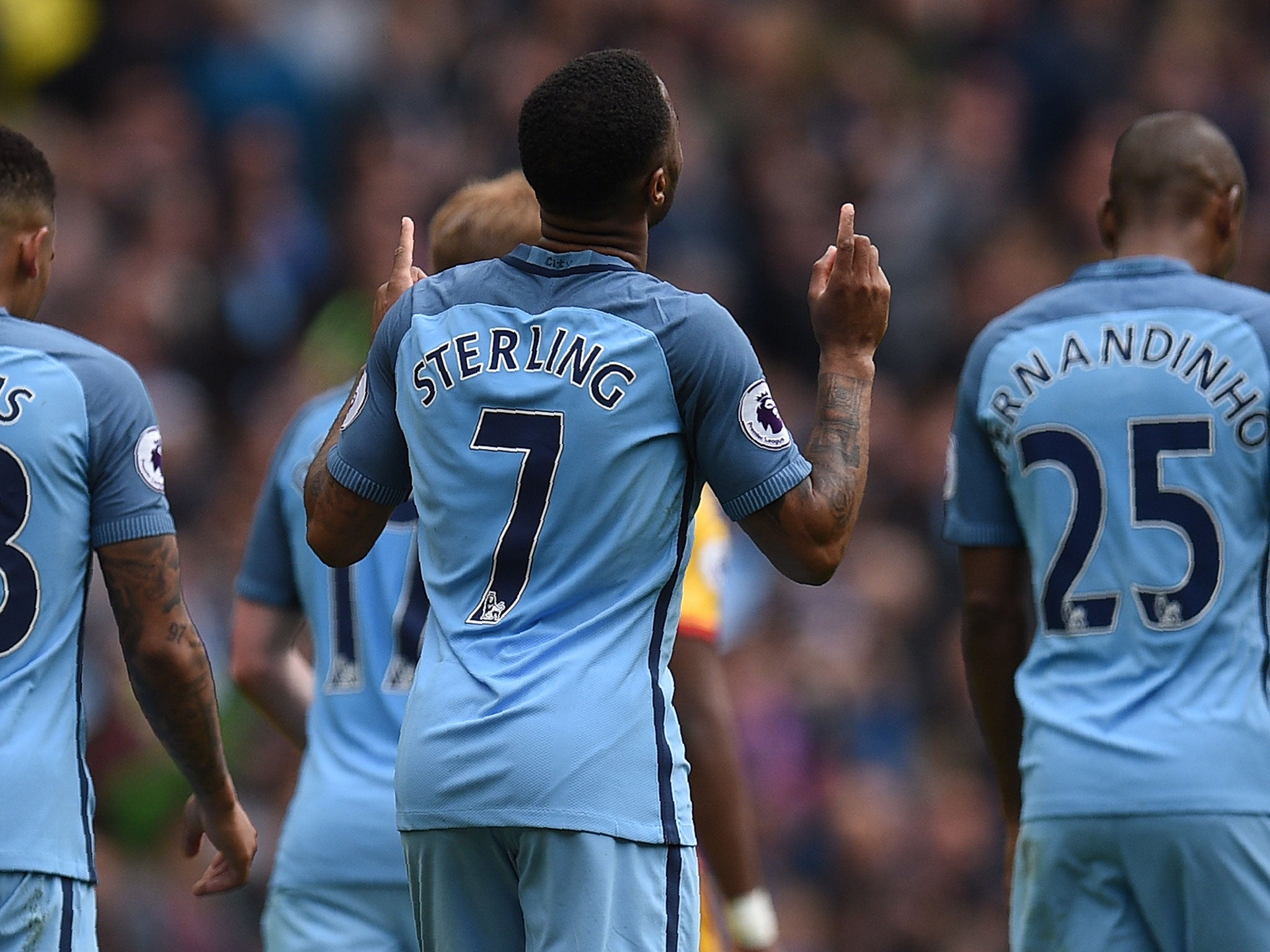 Raheem Sterling celebrates adding the fourth for City