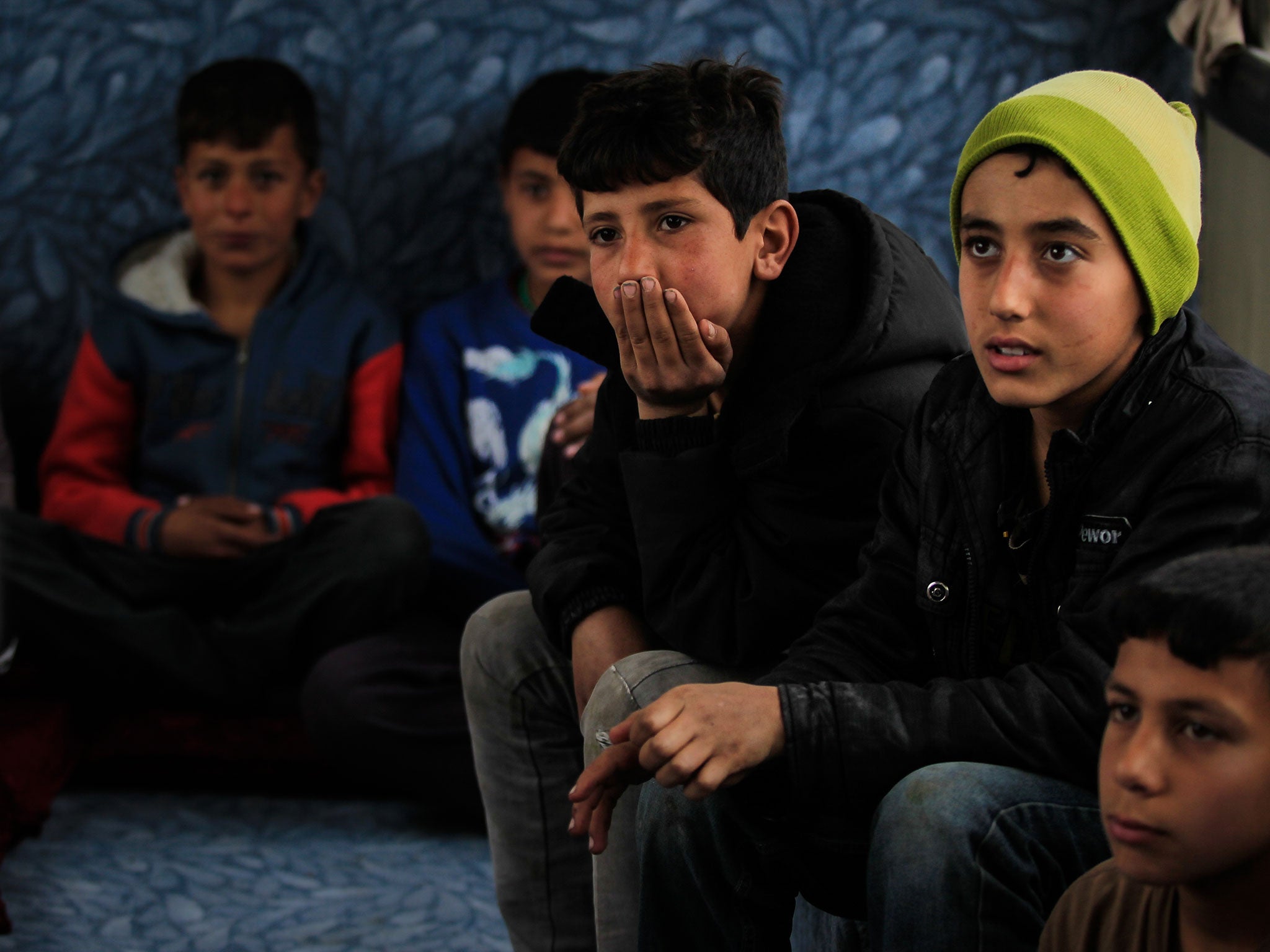 Children with charity workers in Tel Kaif, near Mosul