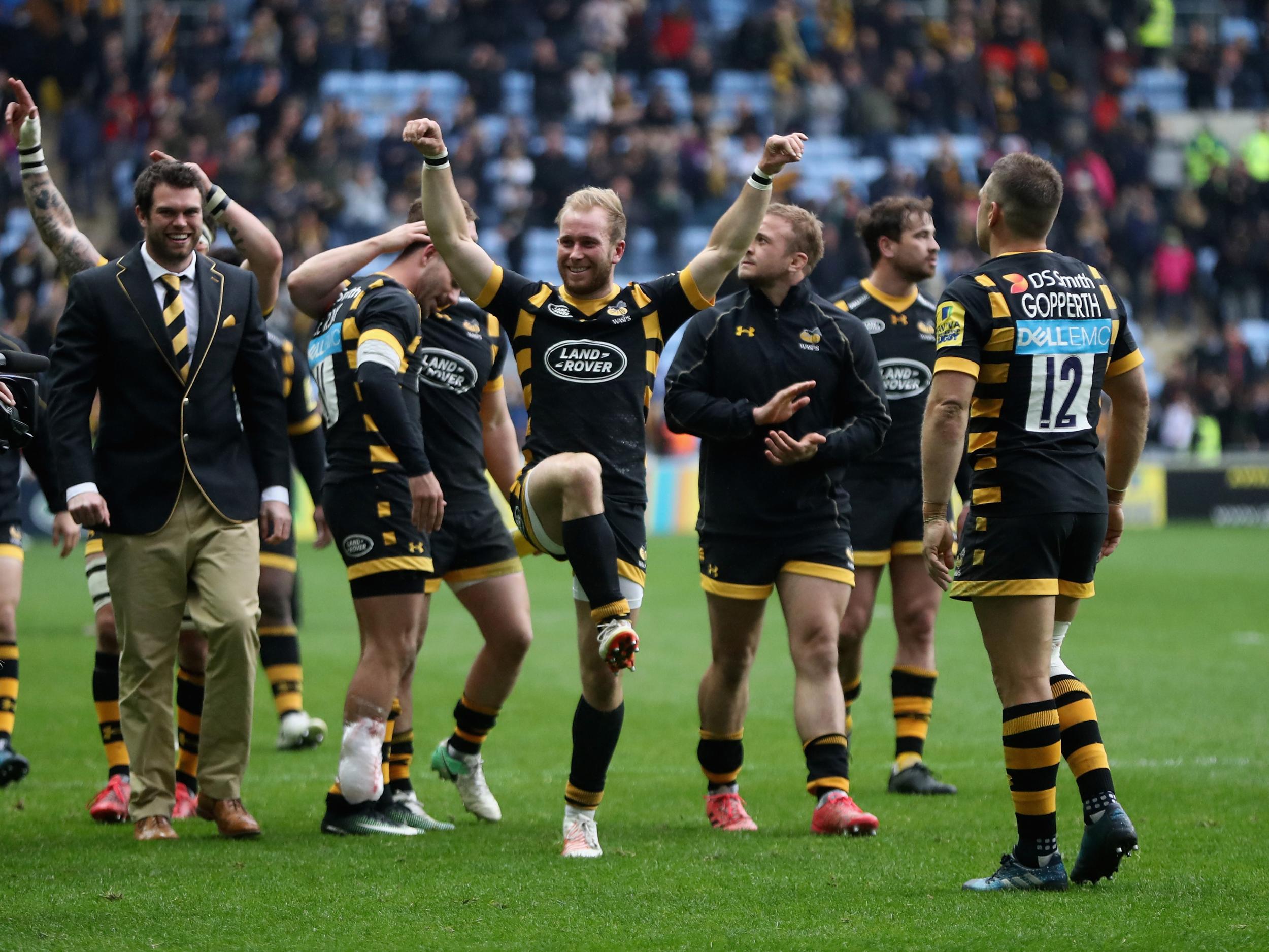 Dan Robson leads the Wasps post-match celebrations after their five-try win