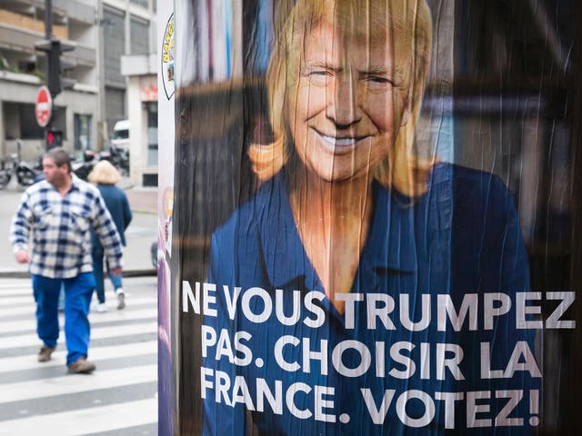 An anti-Le Pen poster in Paris depicts the Front National leader with the face of US President, reading: ‘Do not Trump yourself. Choose France. Vote!’ (Ge