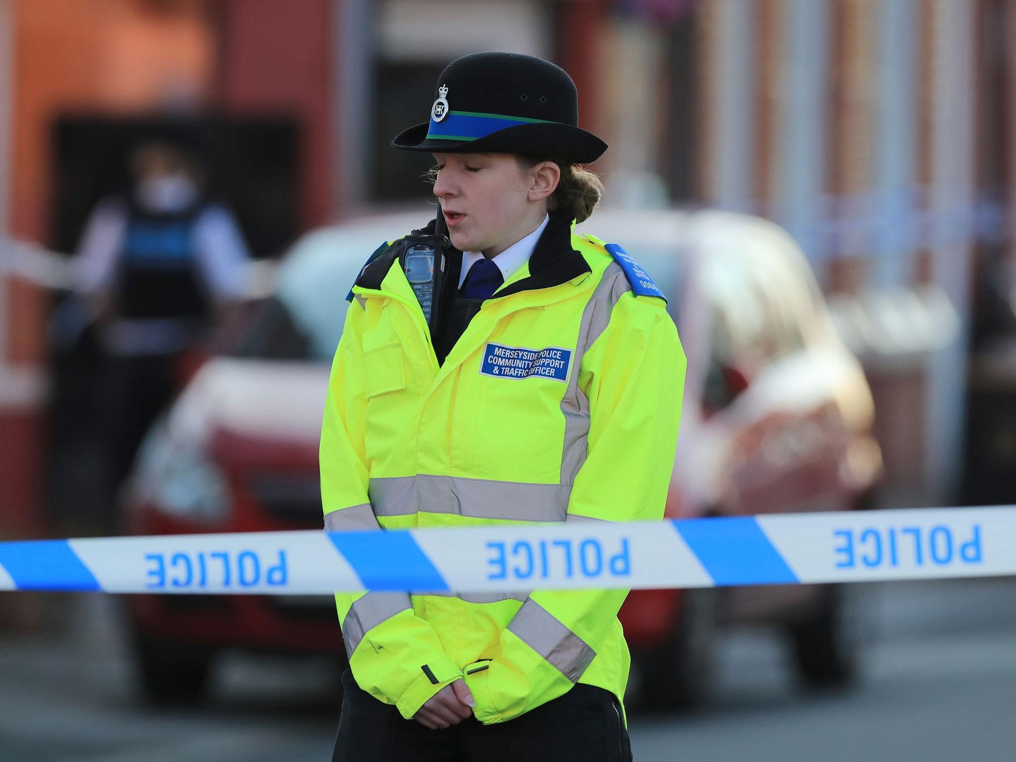 Police close the road in Cockburn Street in Toxteth, Liverpool, after a two-year-old girl was seriously injured after being attacked by dogs in the garden of a house in Liverpoo