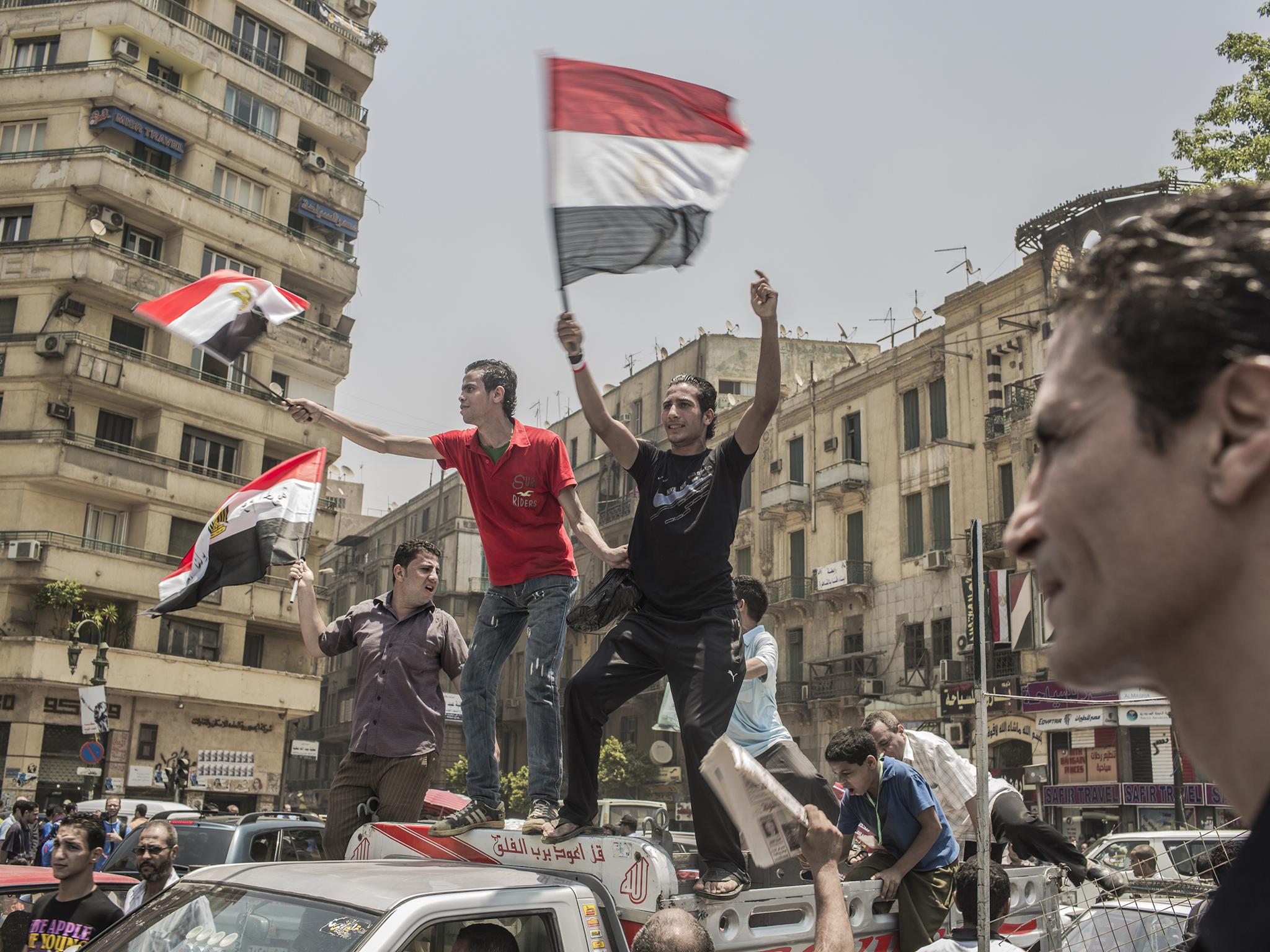 Egyptians supporters celebrate a premature victory for their presidential candidate Mohamed Morsi in Tahrir Square