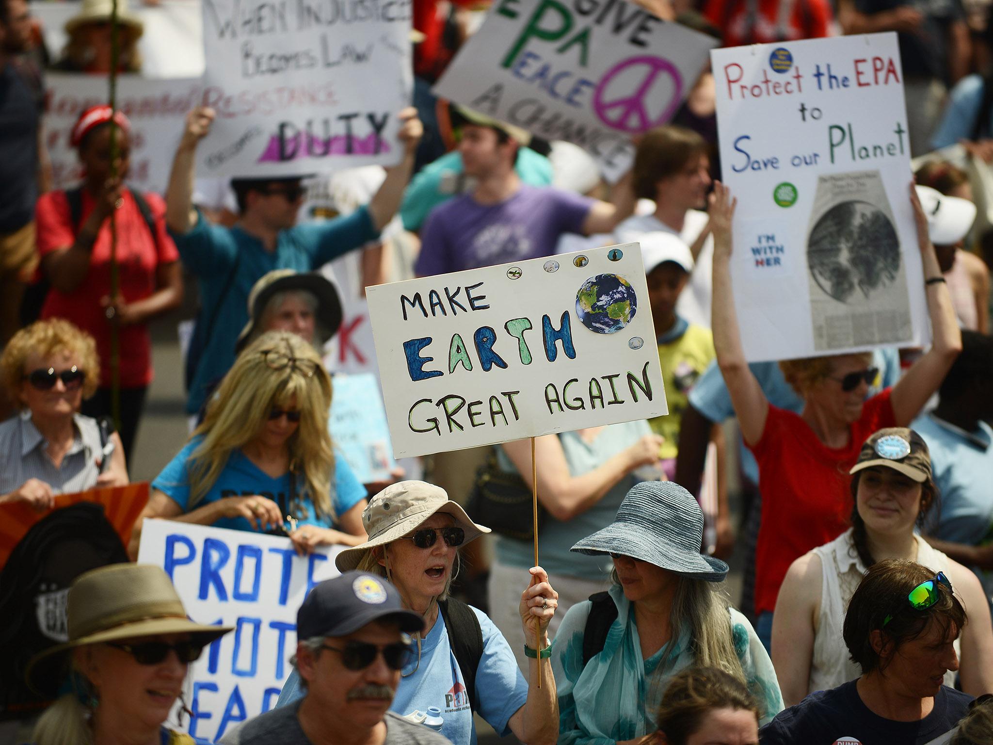 Thousands marched in Washington DC on Trump's 100th day in office to protest against the President's environmental policies