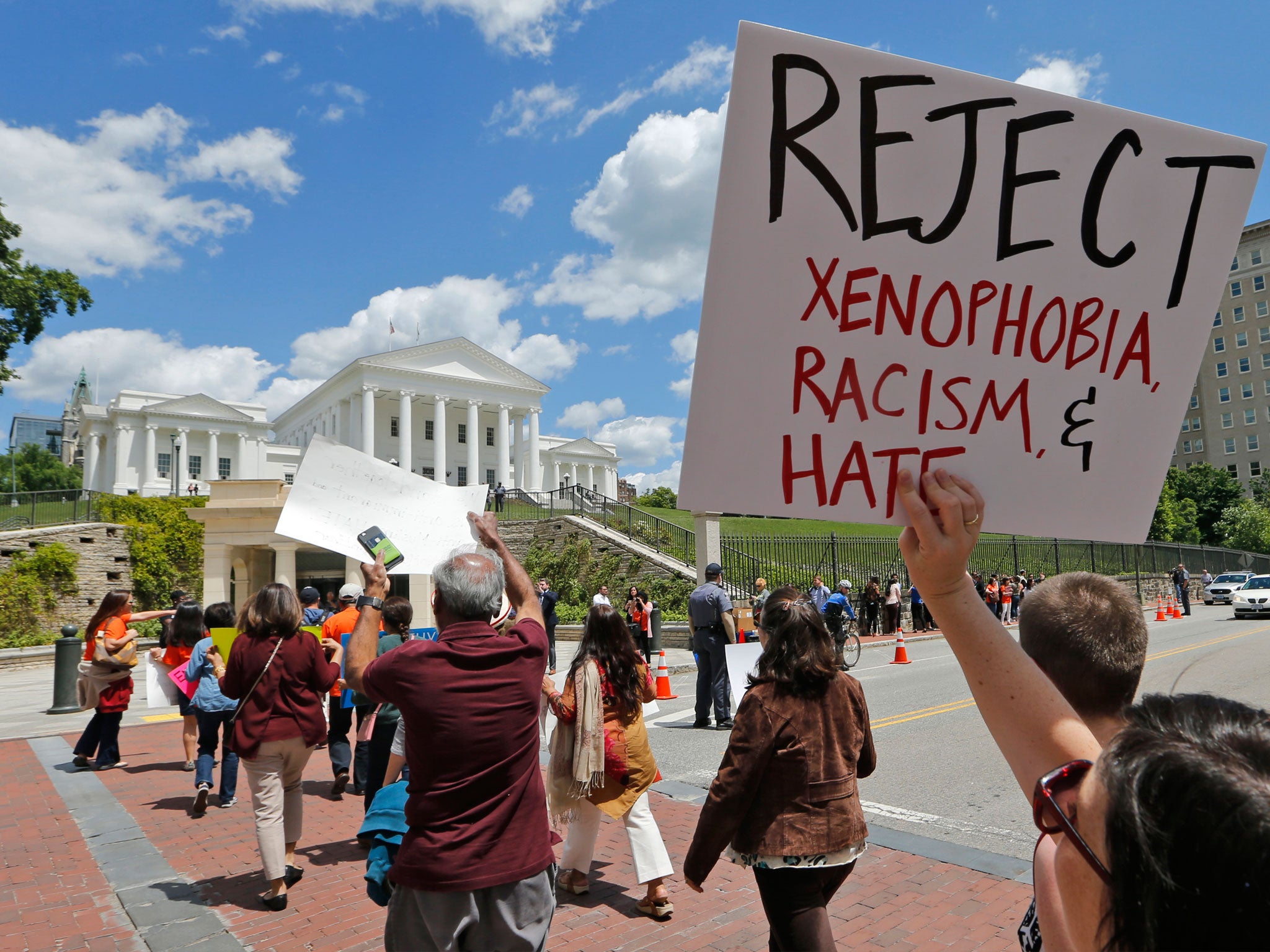 Protesters against Trump’s executive order gathered near the court in Virginia