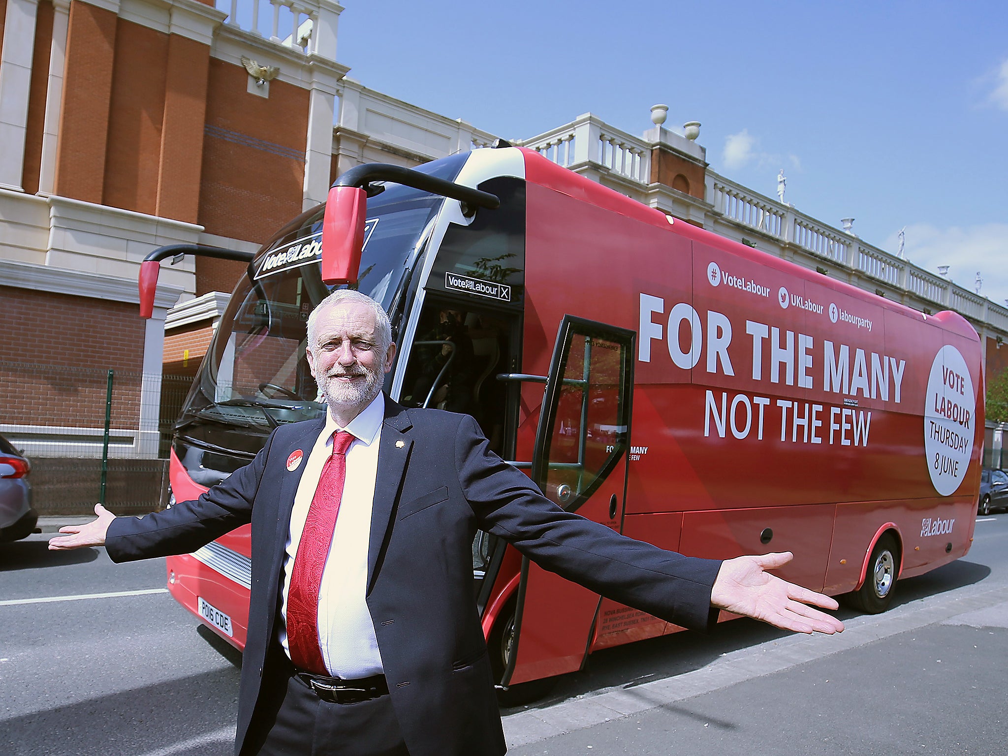 Britain's Labour Party Leader Jeremy Corbynposesfor a picture with his campaign bus in Manchester