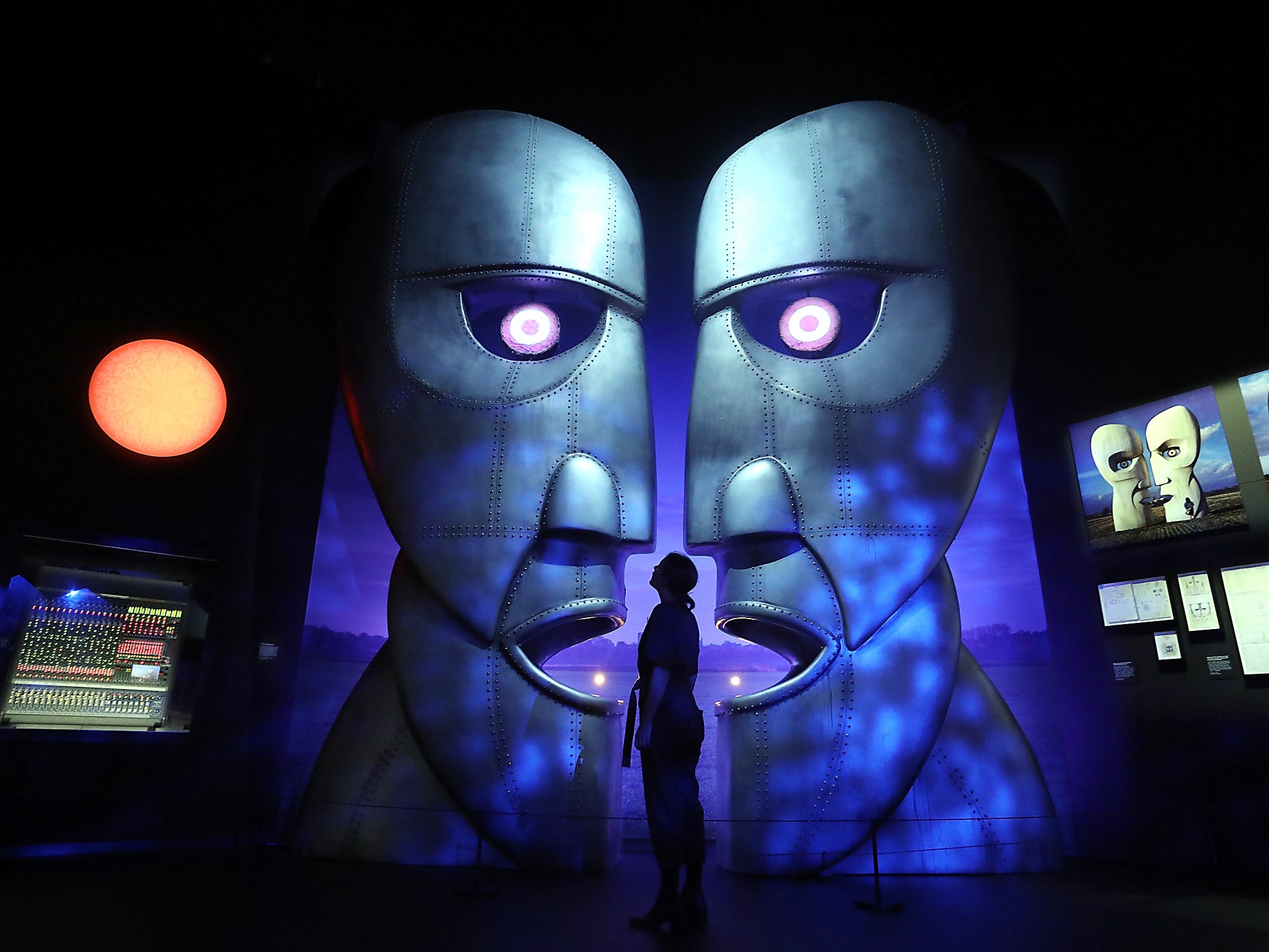 A display showing the Division Bell metal heads during a preview of the Pink Floyd Exhibition: Their Mortal Remains at The V&A in London