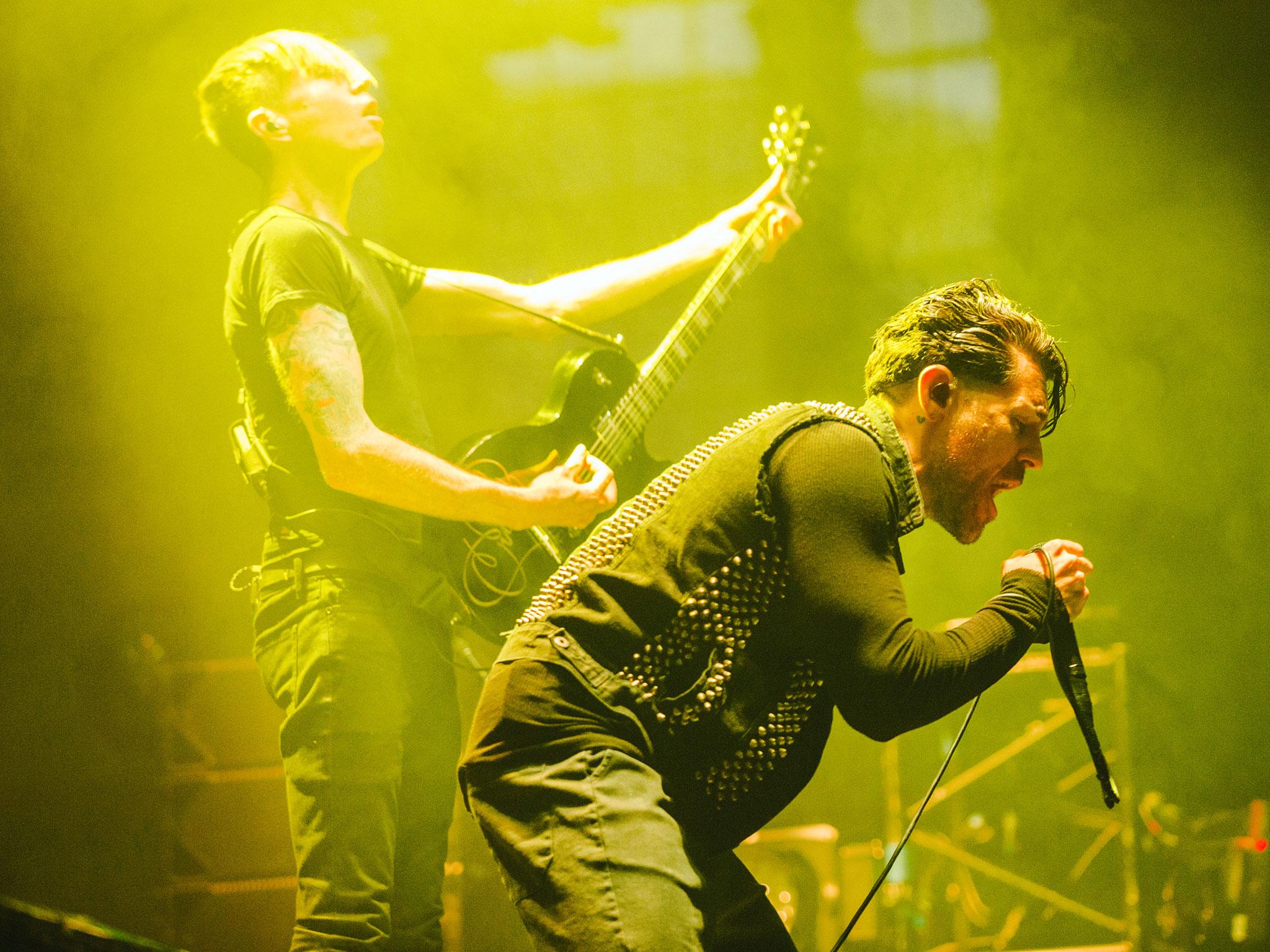 AFI guitarist Jade Puget, left, and vocalist Davey Havok, right, perform at London's Alexandra Palace