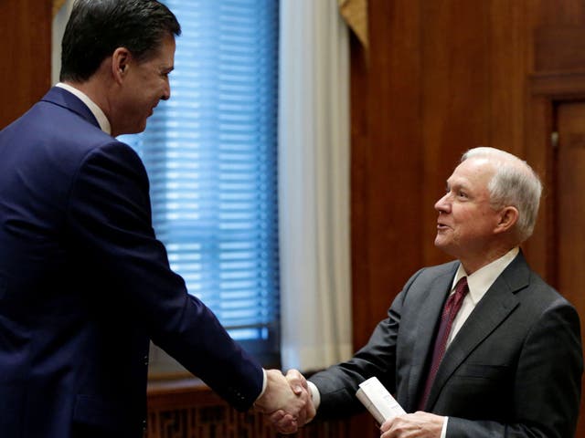 Attorney General Jeff Sessions (R) shakes hands with former FBI Director James Comey