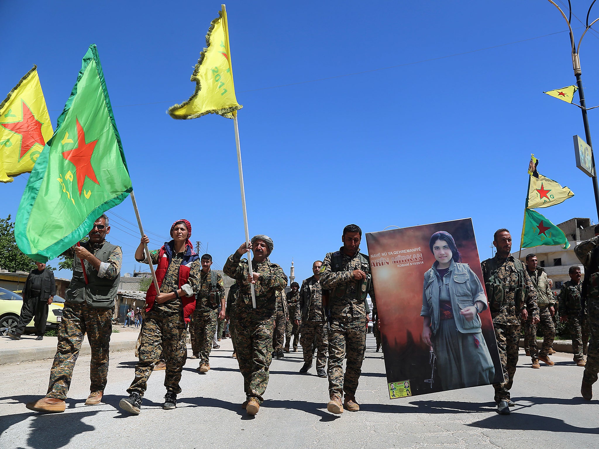 Fighters from the YPG in the northeastern Syrian city of Qamishli last month