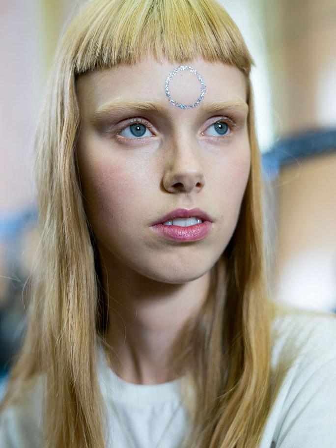 Holographic glitter shapes adorned models’ faces and ears at Giamba