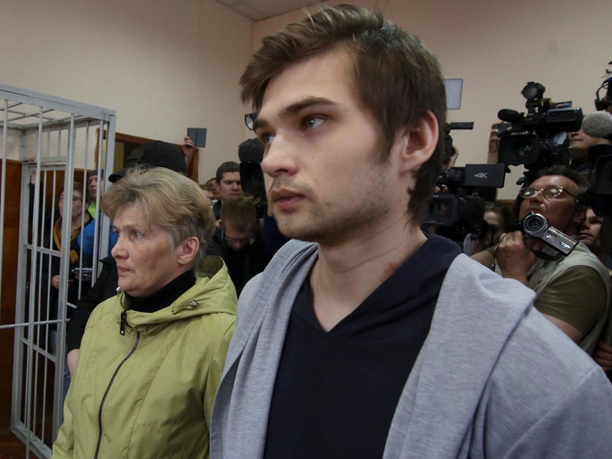 Ruslan Sokolovsky stands with his mother Yelena Chingina in court during his sentencing in Yekaterinburg, Russia