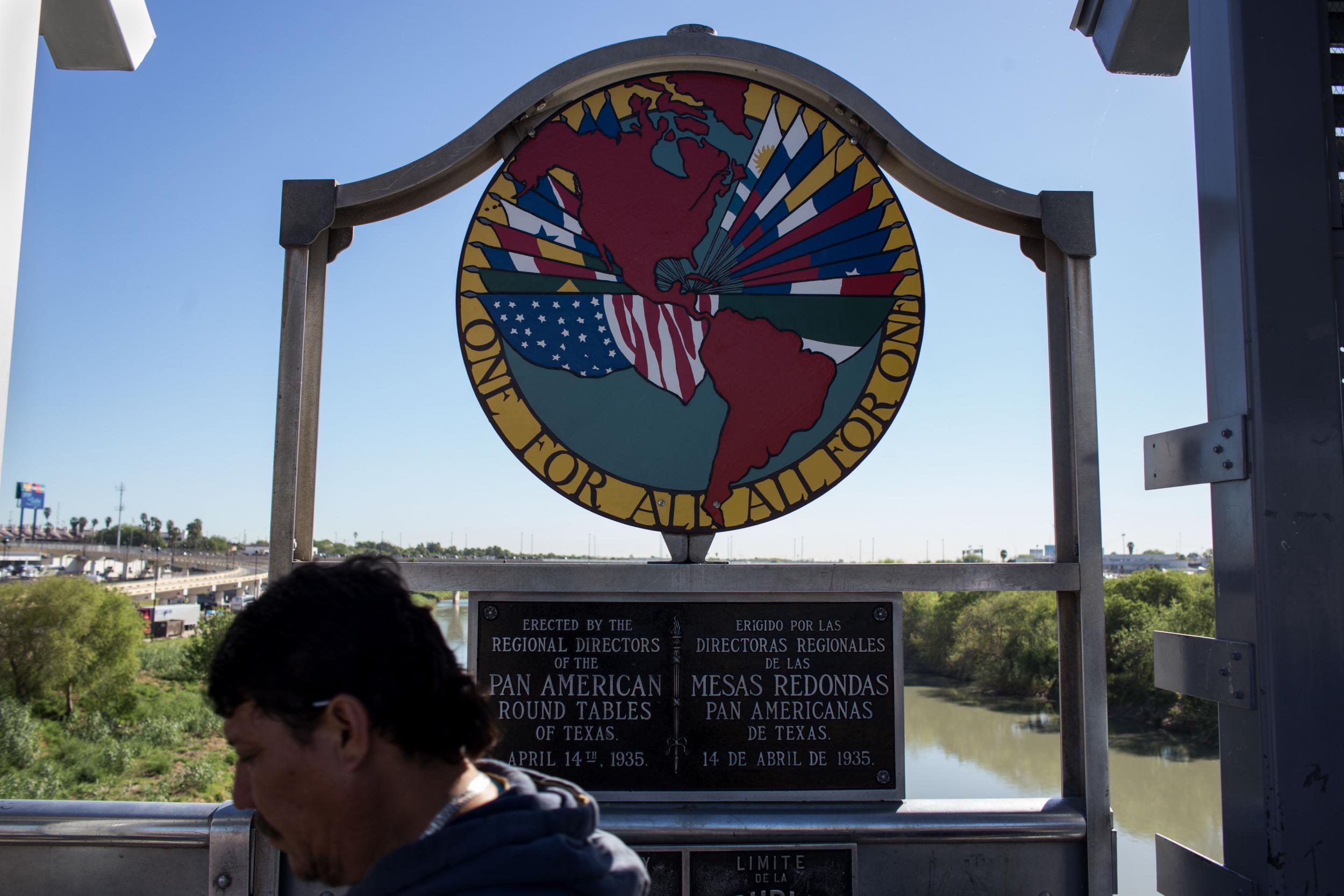 A man crosses the international bridge on the US-Mexico border in Texas