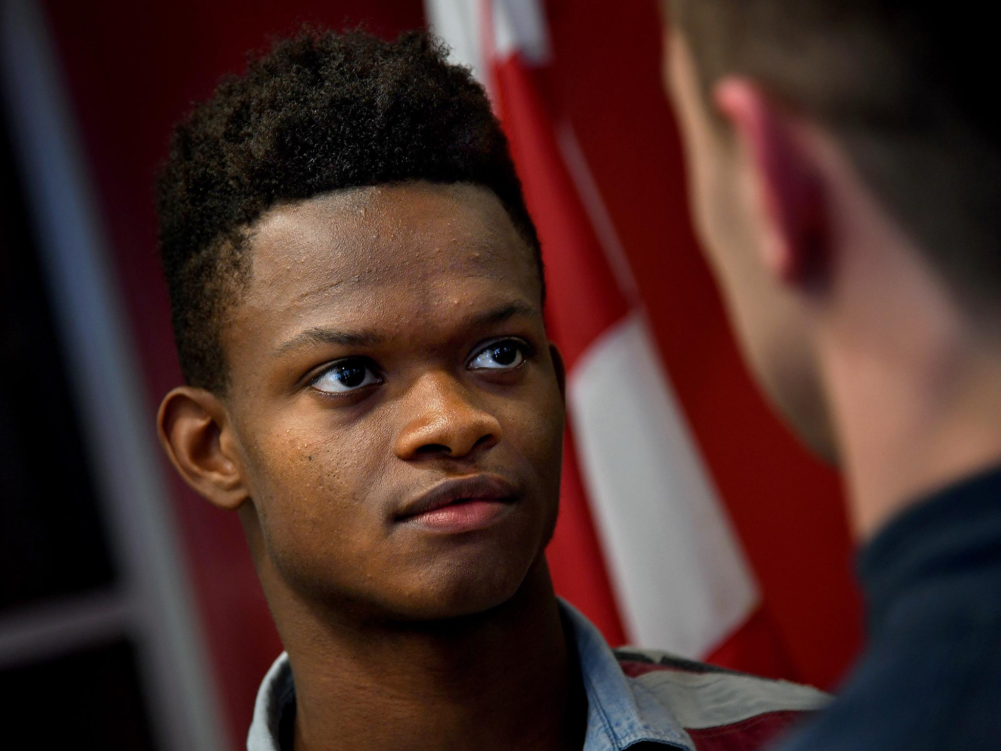 Deonte Washington faces his opponent, Colm Quinn, at a weigh-in at the DC Chamber of Commerce