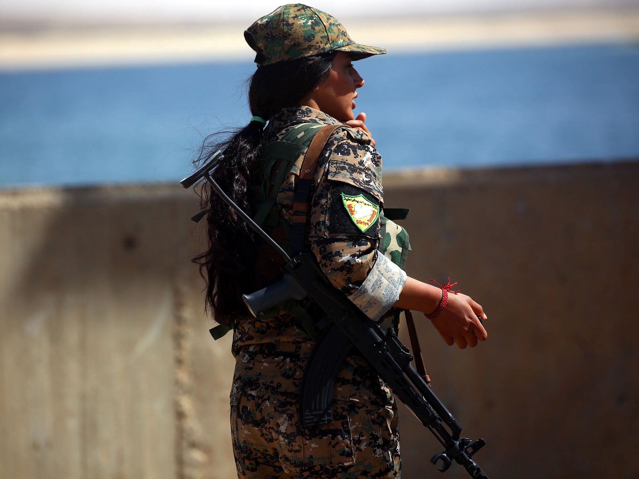 A member of the US-backed Syrian Democratic Forces (SDF) at the Tabqa Dam on 11 May