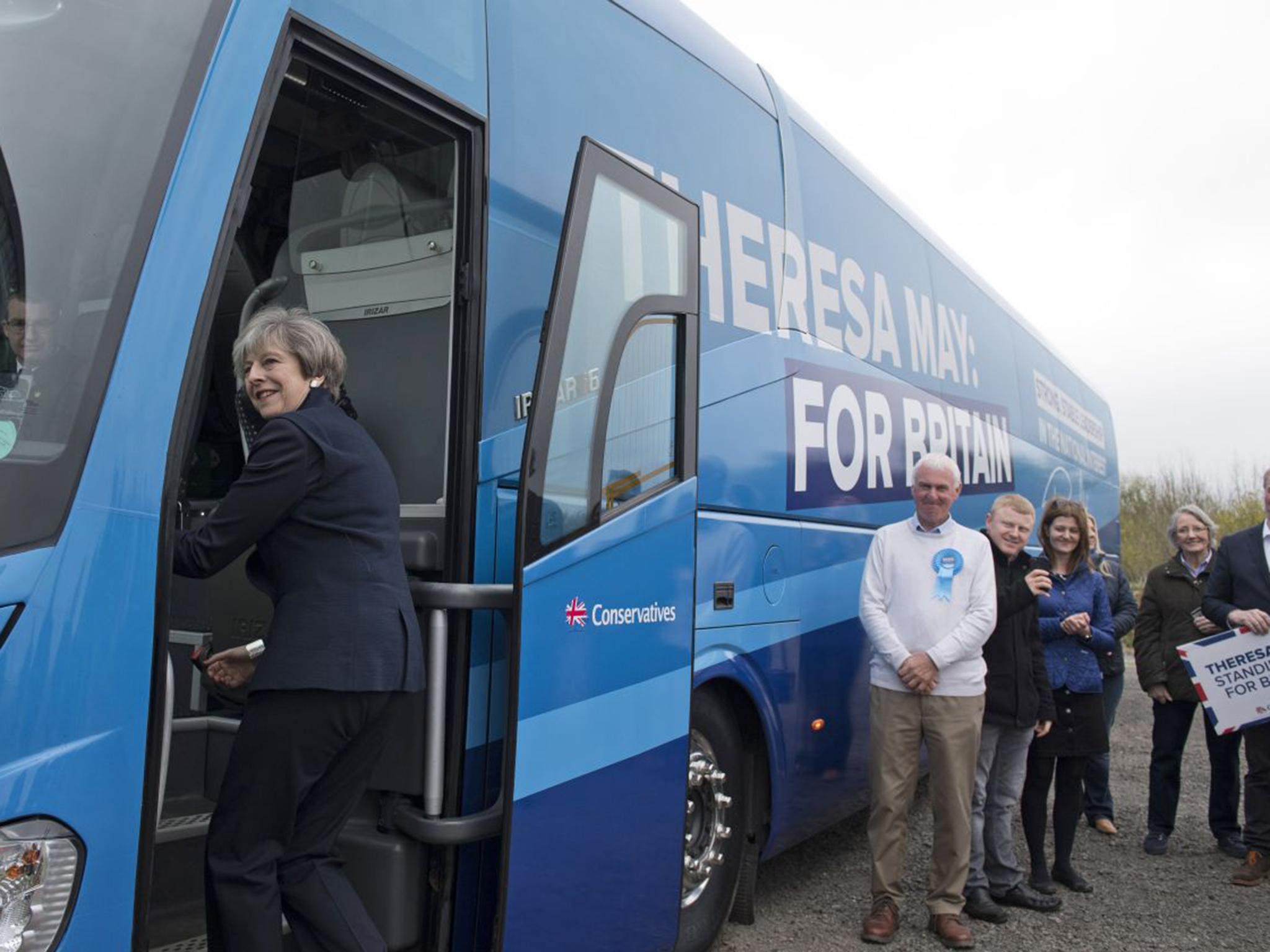 British Prime Minister Theresa May boards the Conservative party's general election campaign "battle bus" after making a speech at an airfield north of Newcastle